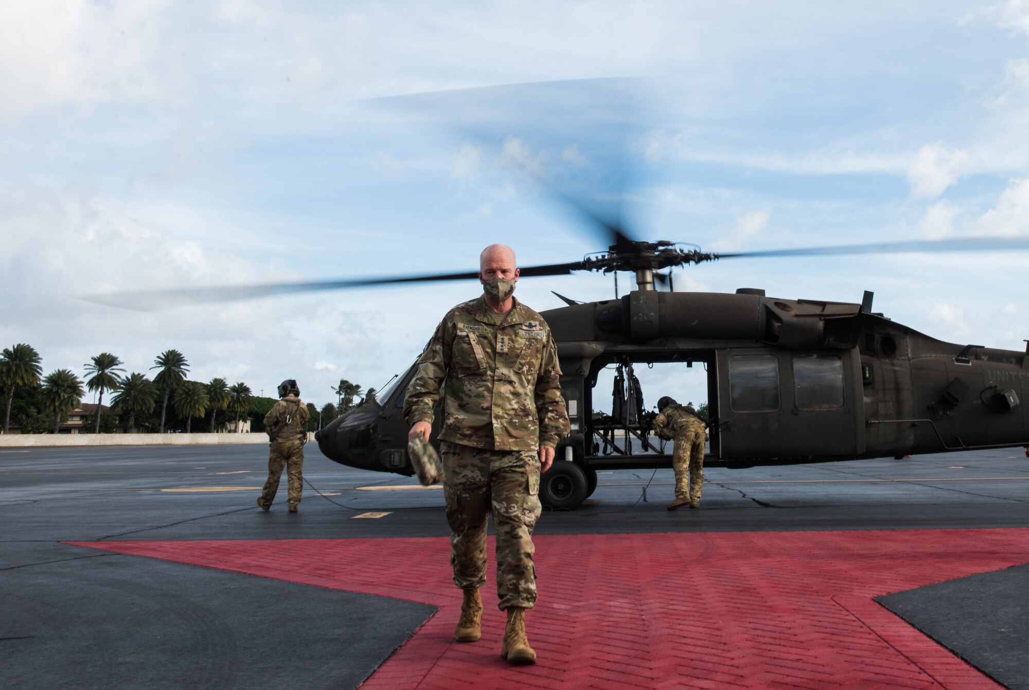 U.S. Space Force Gen. John W. "Jay" Raymond, Chief of Space Operations, walks off the flightline after a visit to the 21st Space Operations Squadron (SOS), Ka’ena Point, Oahu, Nov. 21, 2020. Ka’ena Point is part of the Air Force Satellite Control Network, which consists of seven remote tracking stations located around the world. Raymond visited the 21st SOS detachment during his first official visit to Pacific Air Forces Headquarters at Joint Base Pearl Harbor-Hickam, Hawaii. (U.S. Air Force photo by Staff Sgt. Hailey Haux)