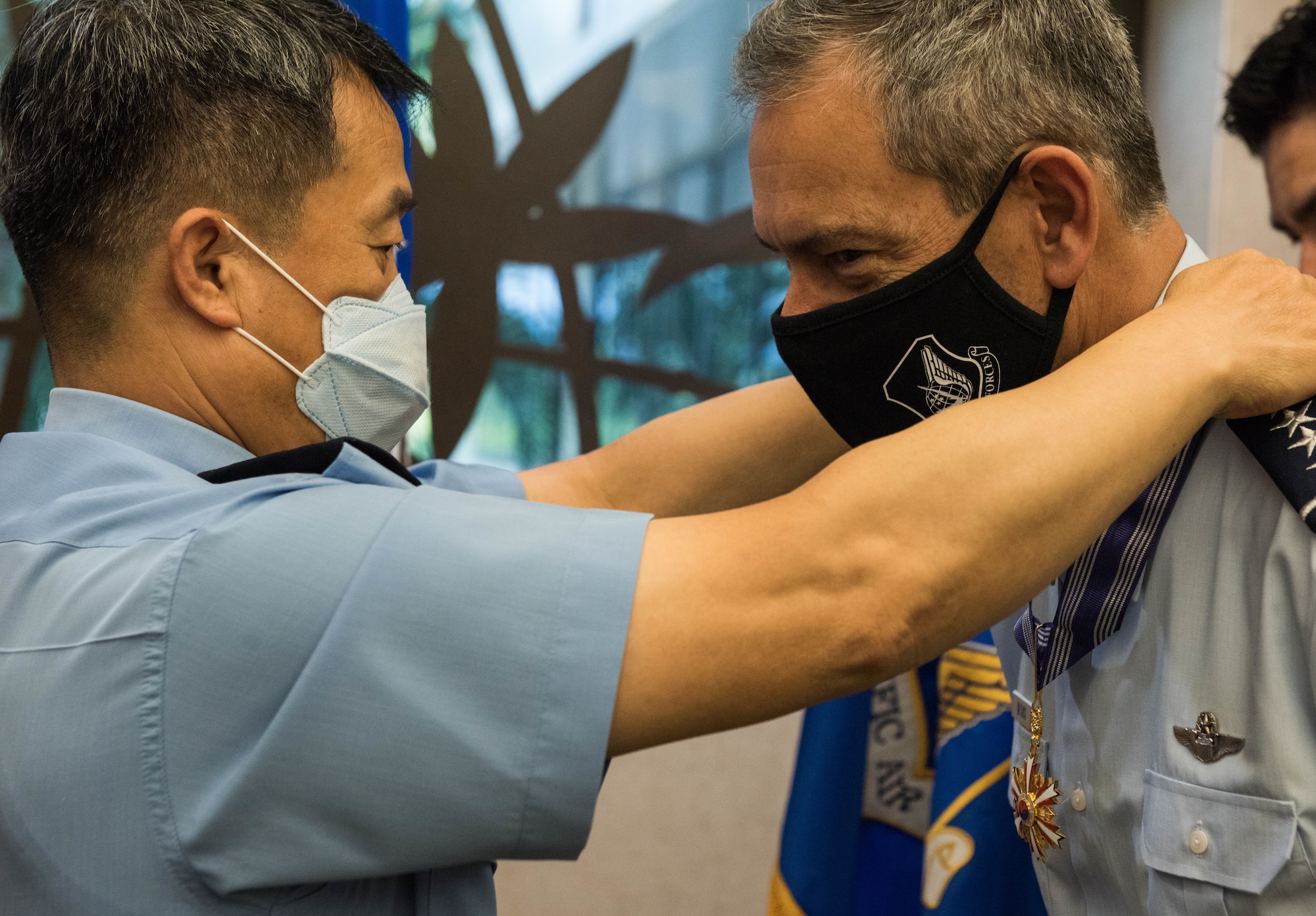 U.S. Air Force Gen. Ken Wilsbach, Pacific Air Forces (PACAF) commander, receives the Order of National Security Merit Gukseon Medal from Gen. Lee Seong Yong, Chief of Staff Republic of Korea Air Force (ROKAF), during a visit to PACAF Headquarters on Joint Base Pearl Harbor-Hickam, Hawaii, Nov. 19, 2020. Wilsbach was awarded the medal in recognition of his distinguished service as the commander of the 7th Air Force and contribution to the security on the Korean Peninsula. (U.S. Air Force photo by Staff Sgt. Hailey Haux)