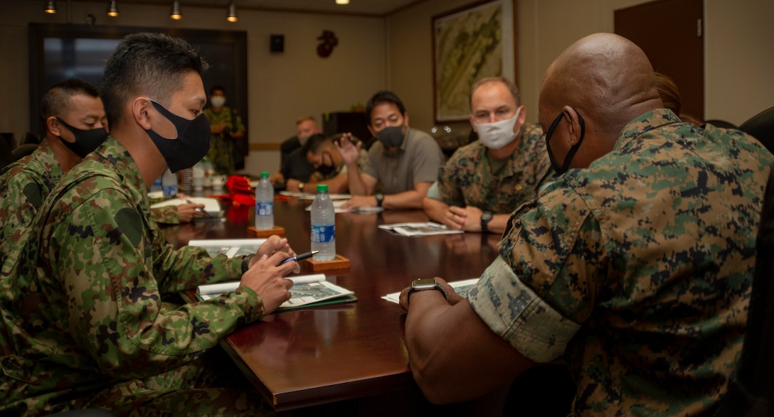 U.S. Marine Corps Col. Henry Dolberry Jr., commanding officer for Marine Corps Air Station (MCAS) Futenma meets with members of the 15th Anti-Air Regiment Japan Ground Self Defense Force (JGSDF) t on MCAS Futenma, Okinawa, Japan, Oct. 26, 2020.  (U.S. Marine Corps photo by Lance Cpl. Alex Fairchild)