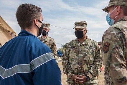 U.S. Army Brig. Gen. Shan K. Bagby, Brooke Army Medical Center commanding general, listens to a brief about the COVID-19 tent operations at the Reid Health Services Center, Nov. 23, 2020, on Joint Base San Antonio-Lackland, Texas.