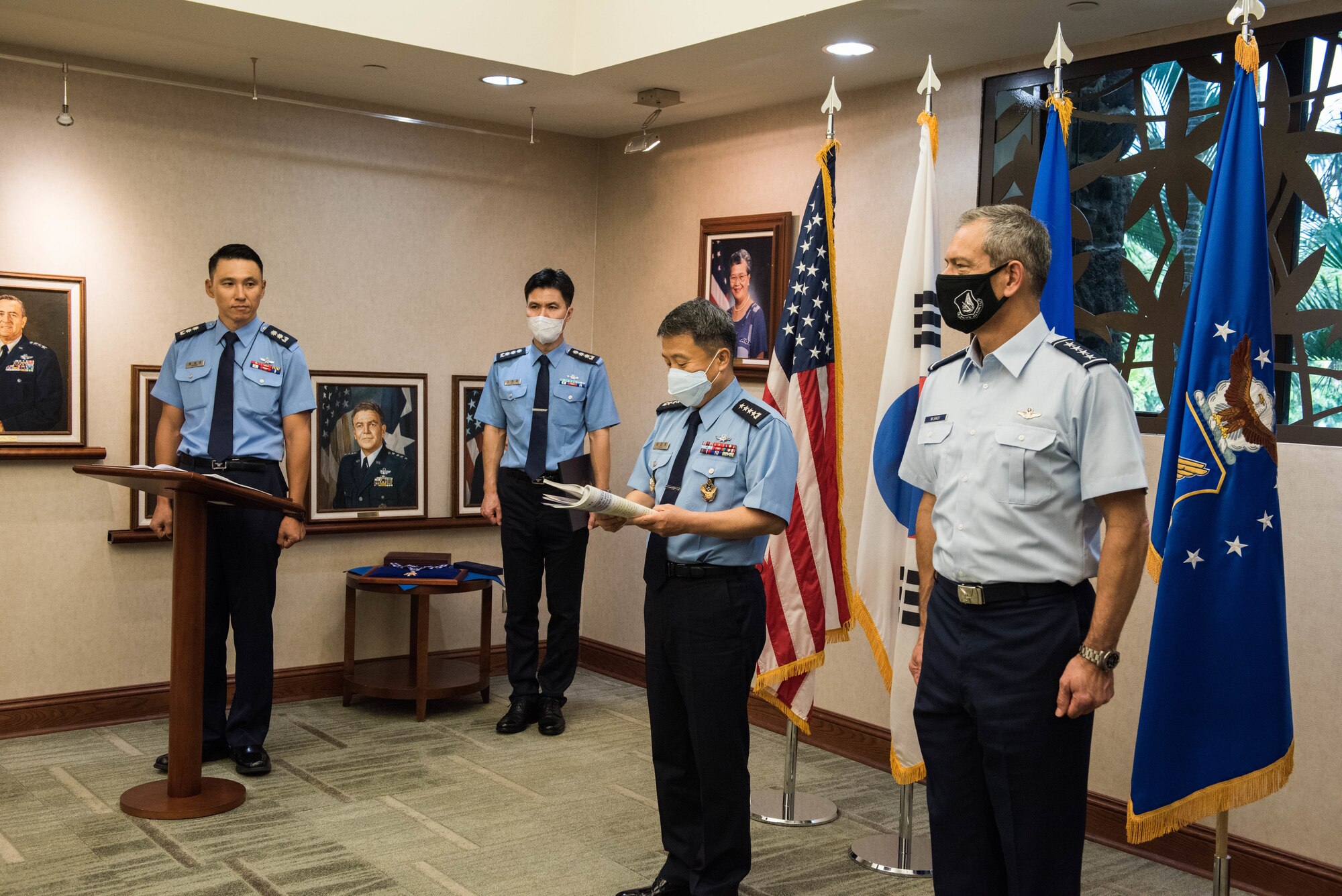U.S. Air Force Gen. Ken Wilsbach, Pacific Air Forces (PACAF) commander, receives the Order of National Security Merit Gukseon Medal from Gen. Lee Seong Yong, Chief of Staff Republic of Korea Air Force (ROKAF), during a visit to PACAF Headquarters on Joint Base Pearl Harbor-Hickam, Hawaii, Nov. 19, 2020. Wilsbach was awarded the medal in recognition of his distinguished service as the commander of the 7th Air Force and contribution to the security on the Korean Peninsula. (U.S. Air Force photo by Staff Sgt. Hailey Haux)