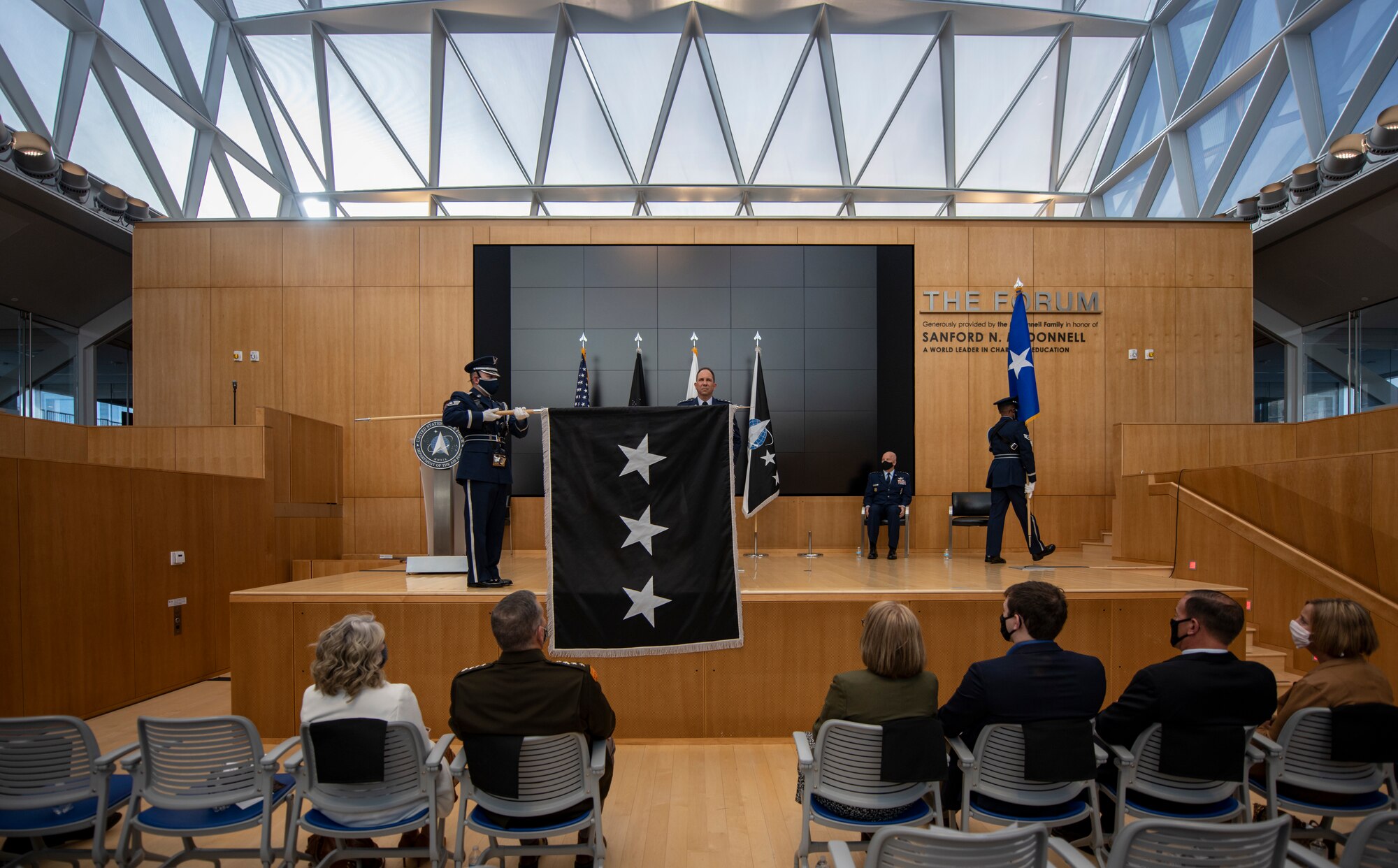 A color guard unfurls a U.S. Space Force flag for newly promoted Lt. Gen. John Shaw during his promotion and transfer ceremony Nov. 23, 2020, at the U.S. Air Force Academy in Colorado Springs, Colo.