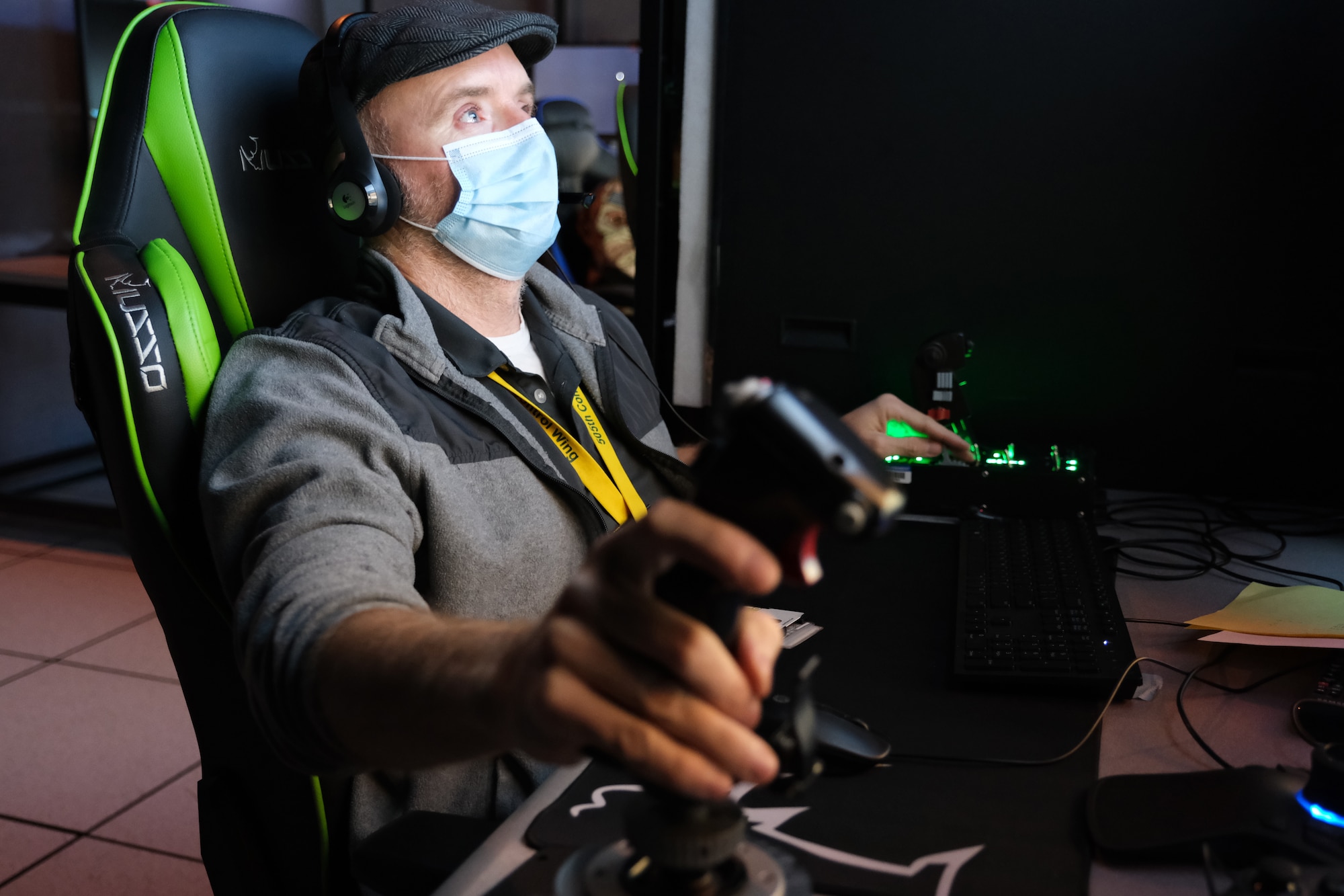 Man seated at simulator.