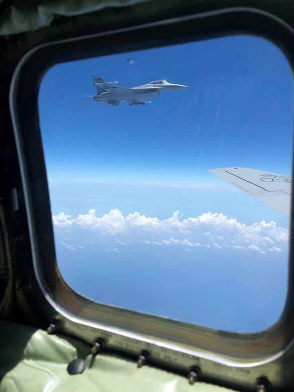 An F-16 Fighting Falcon aircraft assigned to Homestead Air Reserve Base, Fla., flies alongside a KC-135 Stratotanker aircraft from MacDill Air Force Base, Fla., prior to an in-flight refueling, Apr. 15, 2019 over the Atlantic Ocean.