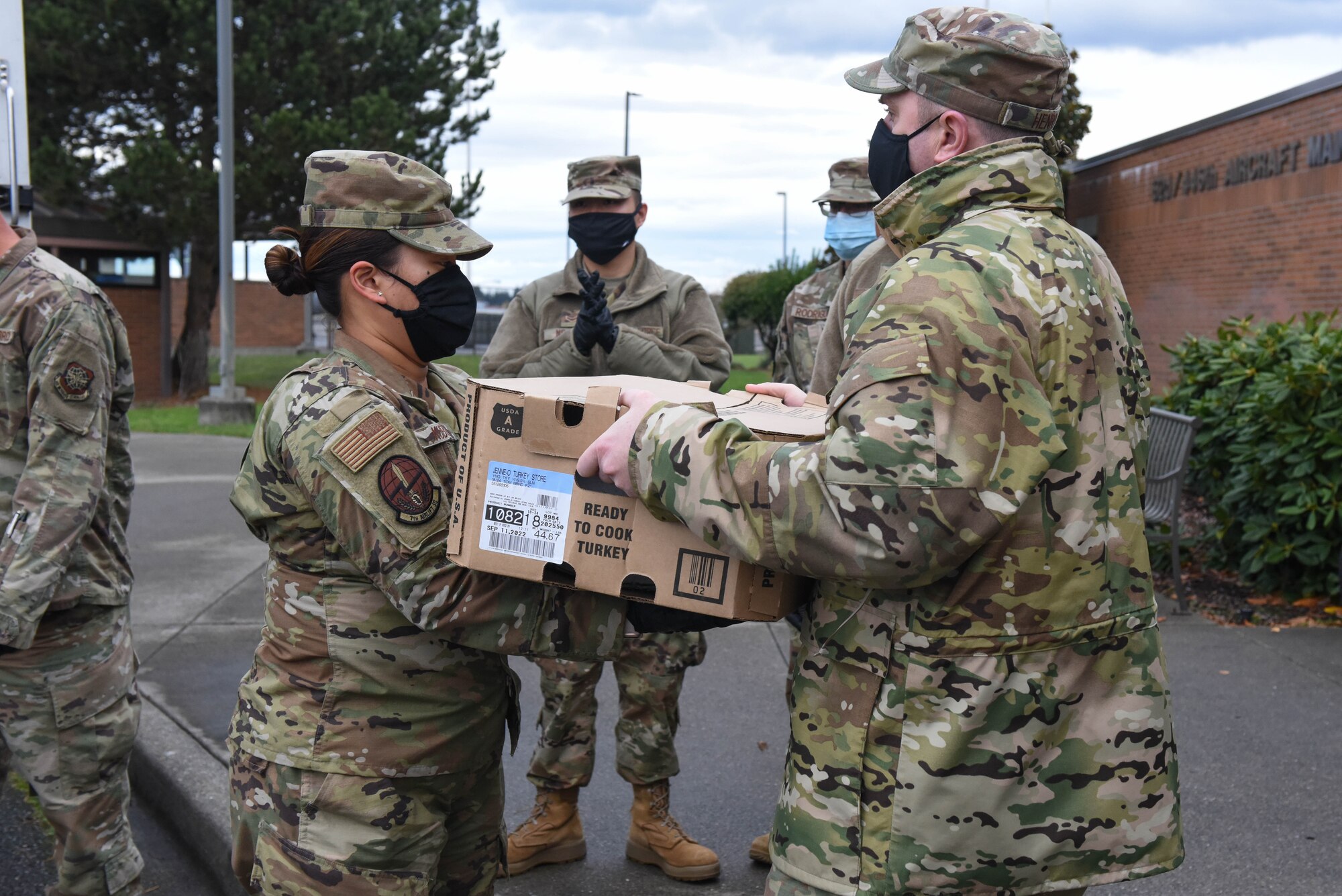 U.S. Air Force Airmen from the 4th, 7th and 8th Airlift Squadrons help distribute turkeys during Operation Turkey Drop at Joint Base Lewis-McChord, Wash., Nov. 17, 2020. The Air Force Association McChord Field Chapter and the Pierce Military and Business Alliance organized the drop of more than 400 turkeys to Airmen at Joint Base Lewis-McChord for the Thanksgiving holiday. (U.S. Air Force photo by Airman 1st Class Callie Norton)