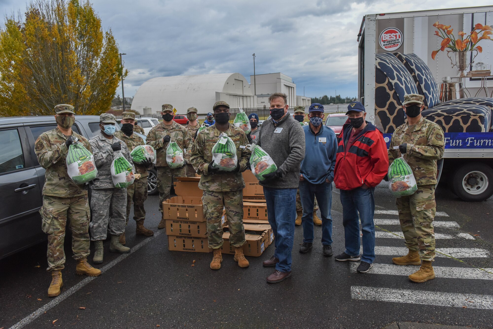 U.S. Air Force Airmen from the 627th Logistics Readiness Squadron and 62nd Maintenance Squadron help distribute turkeys during Operation Turkey Drop at Joint Base Lewis-McChord, Wash., Nov. 17, 2020. The Air Force Association McChord Field Chapter and the Pierce Military and Business Alliance organized the drop of more than 400 turkeys to Airmen at Joint Base Lewis-McChord for the Thanksgiving holiday. (U.S. Air Force photo by Airman 1st Class Callie Norton)