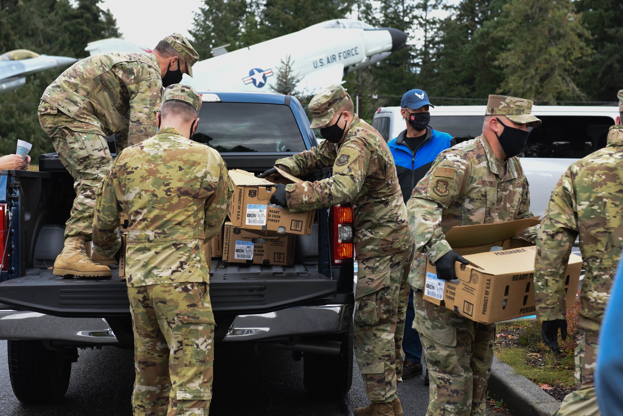 U.S. Air Force Airmen from the 627 Communications Squadron help distribute turkeys during Operation Turkey Drop at Joint Base Lewis-McChord, Wash., Nov. 17, 2020. The Air Force Association McChord Field Chapter and the Pierce Military and Business Alliance organized the drop of more than 400 turkeys to Airmen at Joint Base Lewis-McChord for the Thanksgiving holiday. (U.S. Air Force photo by Airman 1st Class Callie Norton)