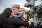 Family embracing during homecoming