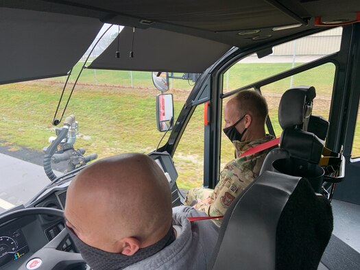Col. Joe Janik, 910th Airlift Wing commander, and John Lewis, Youngstown Air Reserve Station’s fire department chief, try out the fire department’s new PANTHER aircraft rescue and firefighting truck, Nov. 23, 2020, here.