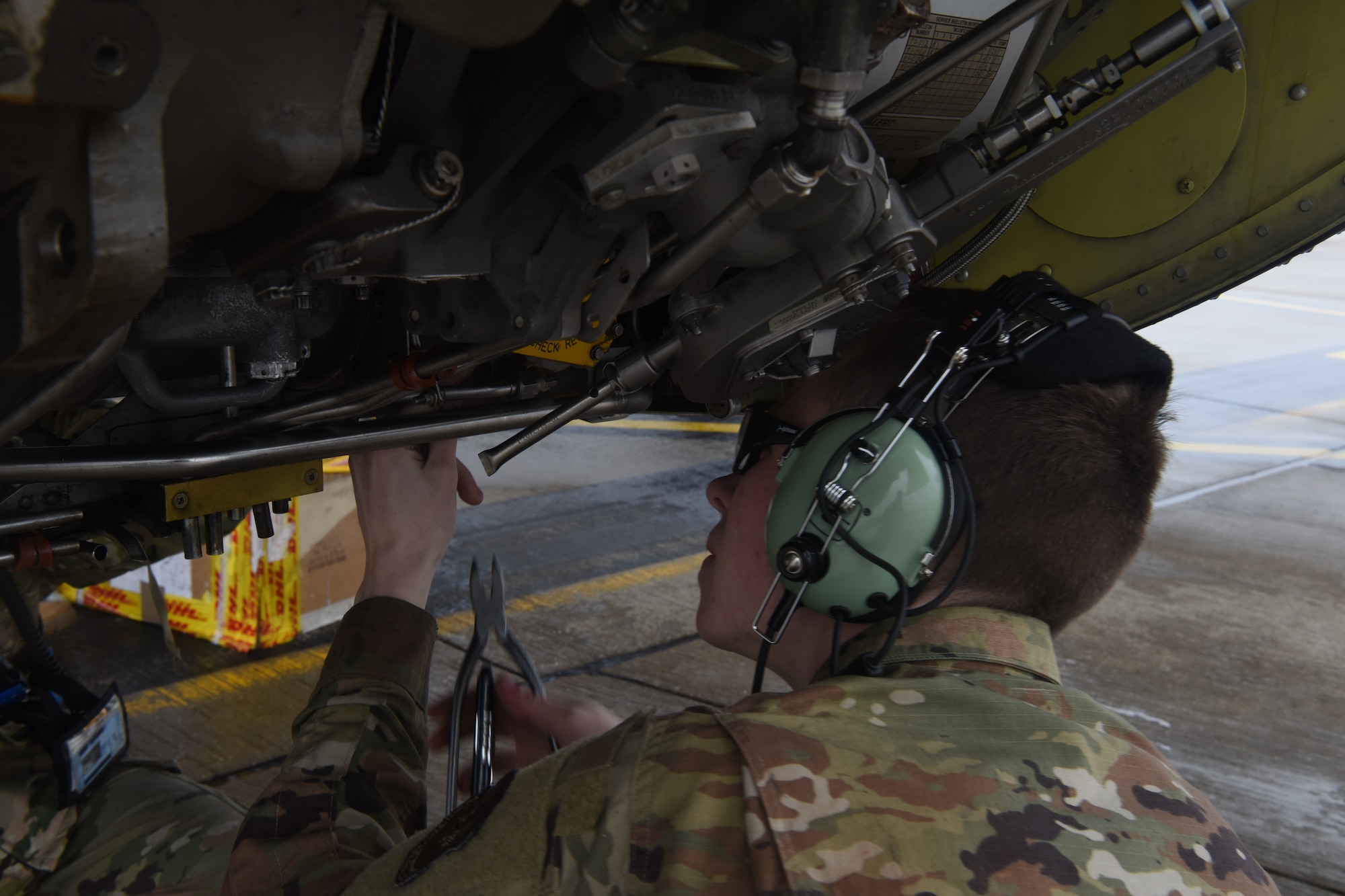Airman 1st Class Drake Koenig-Fredrickson, 100th Aircraft Maintenance Squadron propulsion journeyman, inspects the engine of a KC-135 Stratotanker aircraft at Royal Air Force Mildenhall, England, Oct. 29, 2020. The 100th Maintenance Group provides aircraft maintenance and equipment support to the sole aerial refueling wing within the U.S. Air Forces in Europe and Air Forces Africa area of responsibility. (U.S. Air Force photo by Airman 1st Class David Busby)