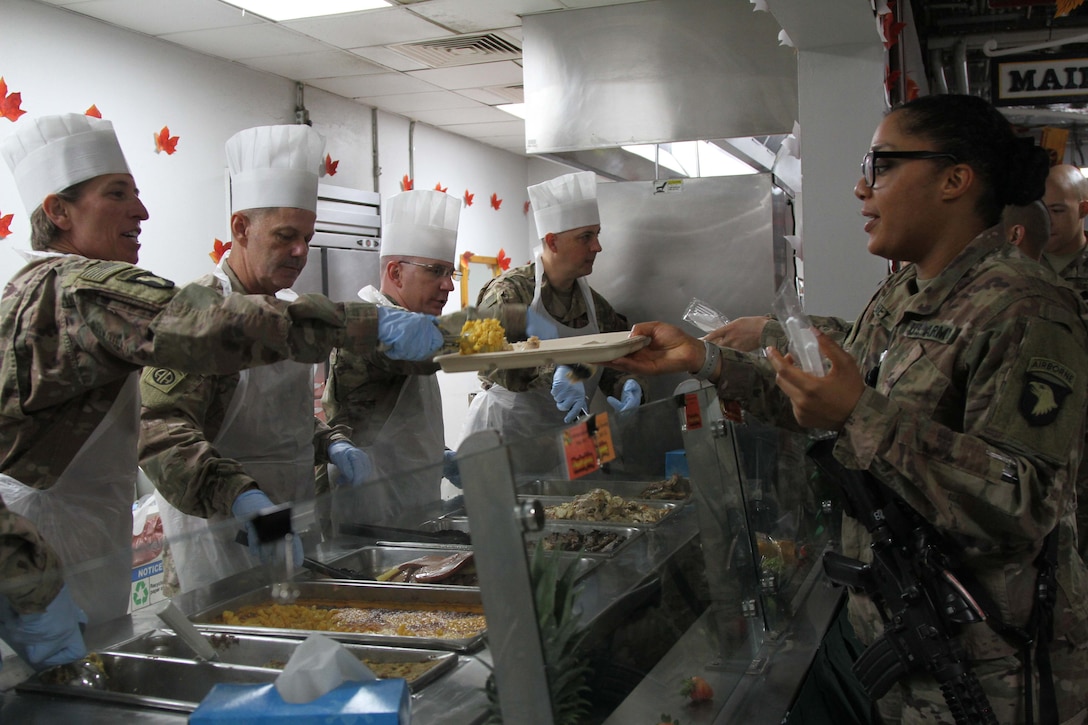 A solder is served Thanksgiving dinner.