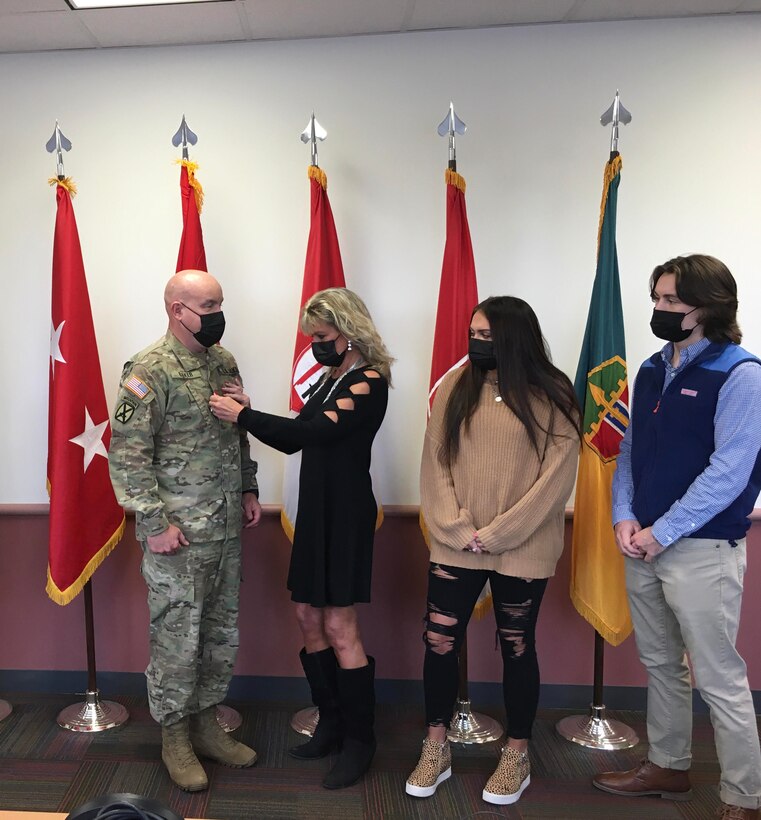 Brig. Gen. Matthew V. Baker was promoted to the rank of Major General during an afternoon ceremony. Daughter, Nikki, and son, Brandon, observed as, wife, Debbie, placed the new rank on their father's uniform.

Photo by: Capt. Nathi (Nate) Kijpatanasilp