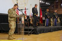Maj. David Evan, chaplain, District of Columbia National Guard, delivers an invocation prior to the DCNG Land Component Command change of responsibility ceremony