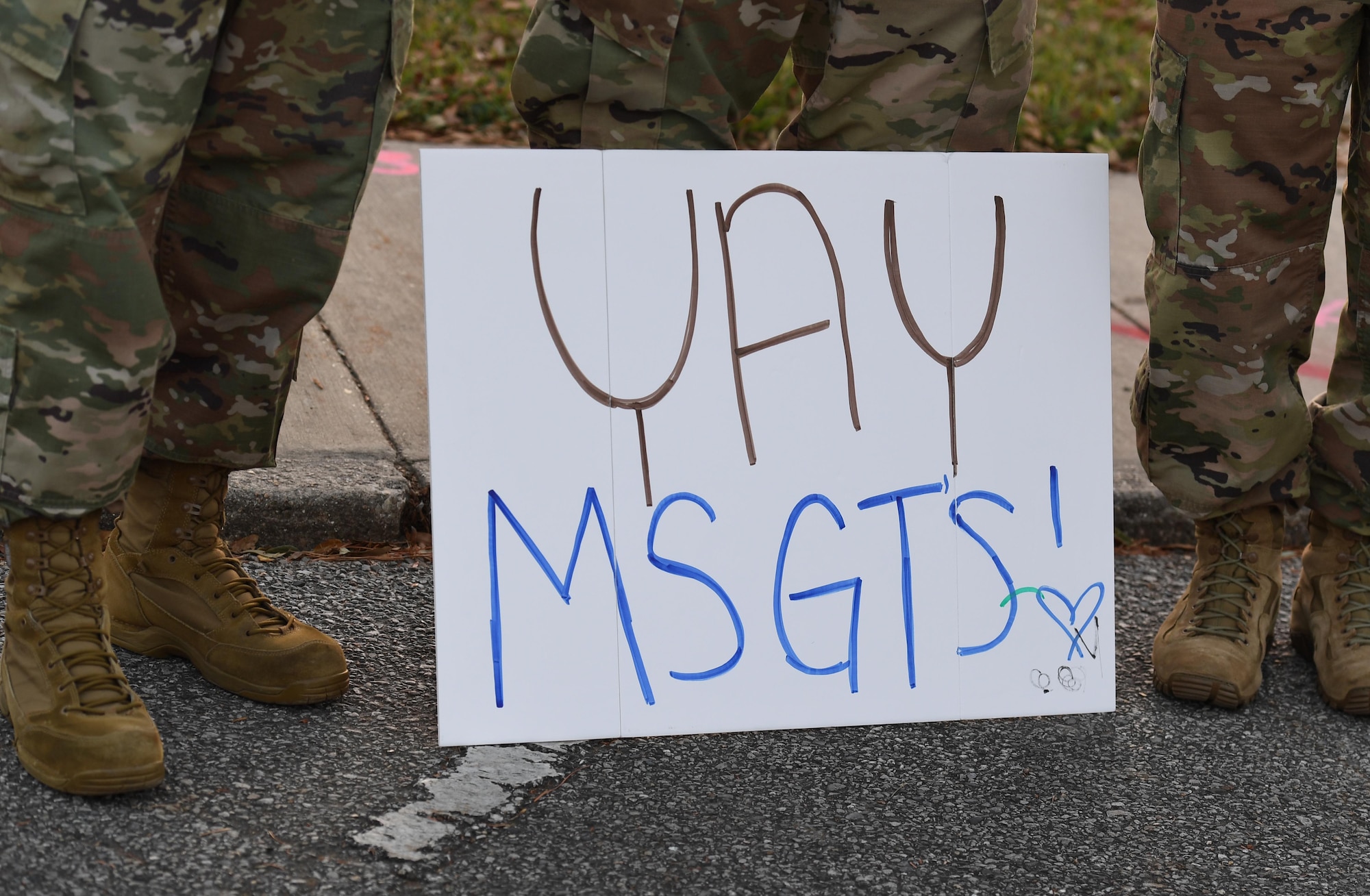 A hand-made sign is on display during the Keesler Senior Noncommissioned Officer Induction Ceremony outside Mathies Hall at Keesler Air Force Base, Mississippi, Nov. 19, 2020. Over 20 Airmen were recognized during the ceremony, which also included a drive-thru congratulatory parade by Keesler personnel. (U.S. Air Force photo by Kemberly Groue)