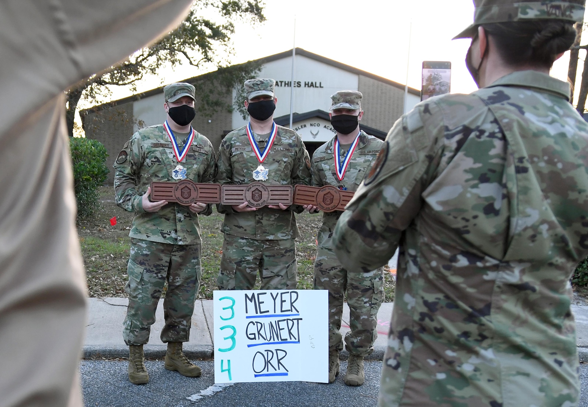 Keesler Senior Noncommissioned Officer inductees pose for a photo during the Keesler Senior NCO Induction Ceremony outside Mathies Hall at Keesler Air Force Base, Mississippi, Nov. 19, 2020. Over 20 Airmen were recognized during the ceremony, which also included a drive-thru congratulatory parade by Keesler personnel. (U.S. Air Force photo by Kemberly Groue)