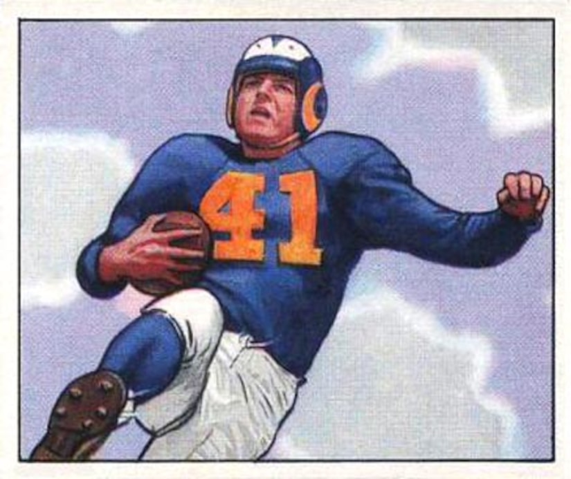A football player leaps into the air cradling a football in his arm.