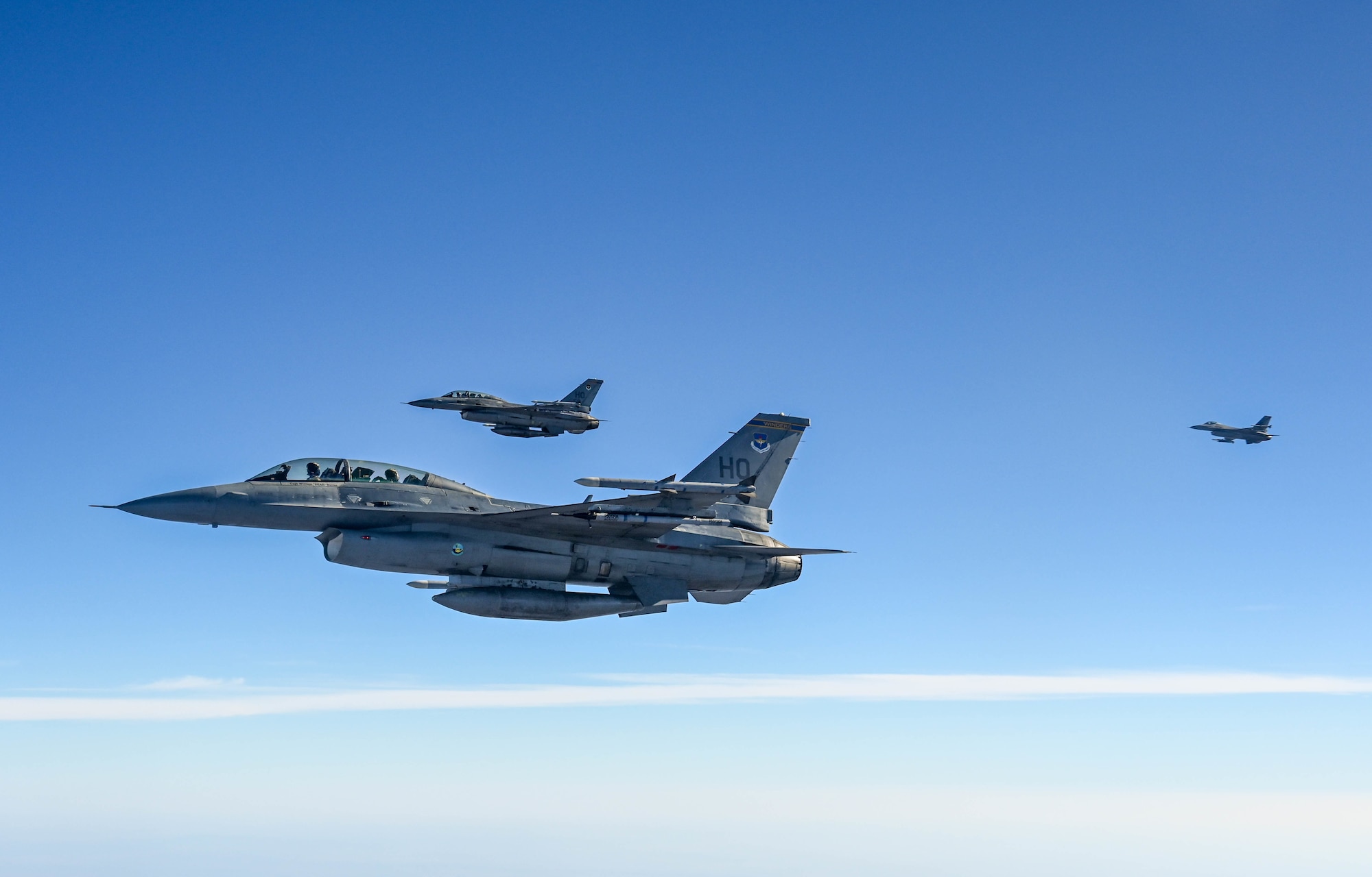 F-16 Fighting Falcons from the 311th Fighter Squadron, fly above New Mexico during an aerial refueling training mission Nov. 20, 2020. (U.S. Air Force photo by Senior Airman Mary Begy)