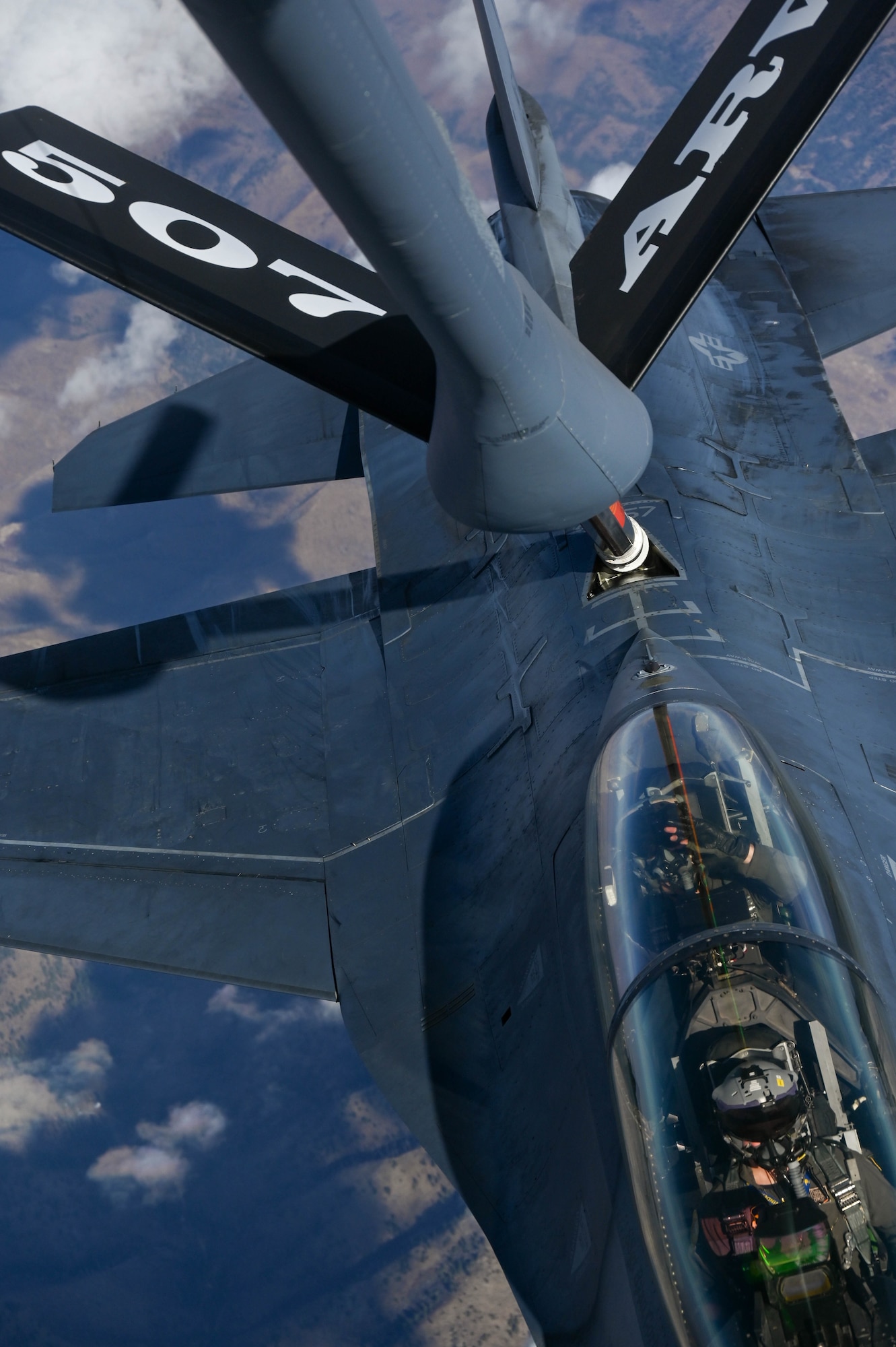 A KC-135R Stratotanker from the 465th Air Refueling Squadron, Tinker Air Force Base, Oklahoma, refuels an F-16 Fighting Falcon from the 311th Fighter Squadron, Holloman Air Force Base, New Mexico, Nov. 20, 2020. (U.S. Air Force photo by Senior Airman Mary Begy)