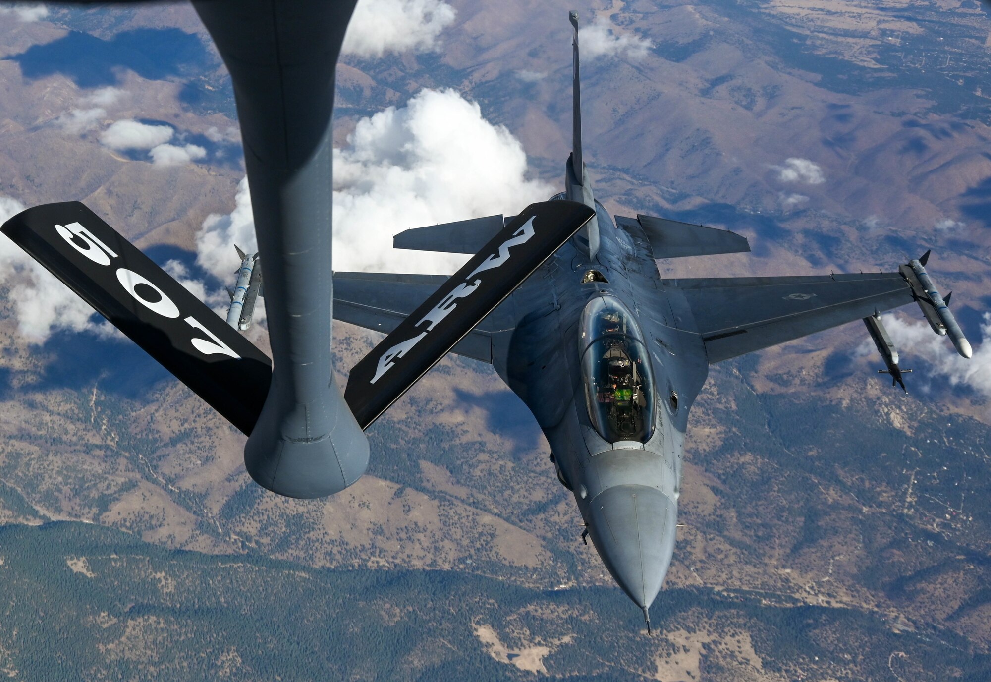 A KC-135R Stratotanker from the 465th Air Refueling Squadron, Tinker Air Force Base, Oklahoma, refuels an F-16 Fighting Falcon from the 311th Fighter Squadron, Holloman Air Force Base, New Mexico, Nov. 20, 2020. (U.S. Air Force photo by Senior Airman Mary Begy)