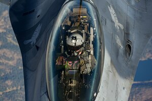 An F-16 Fighting Falcon from the 311th Fighter Squadron, flies above New Mexico during an aerial refueling training mission Nov. 20, 2020. (U.S. Air Force photo by Senior Airman Mary Begy)