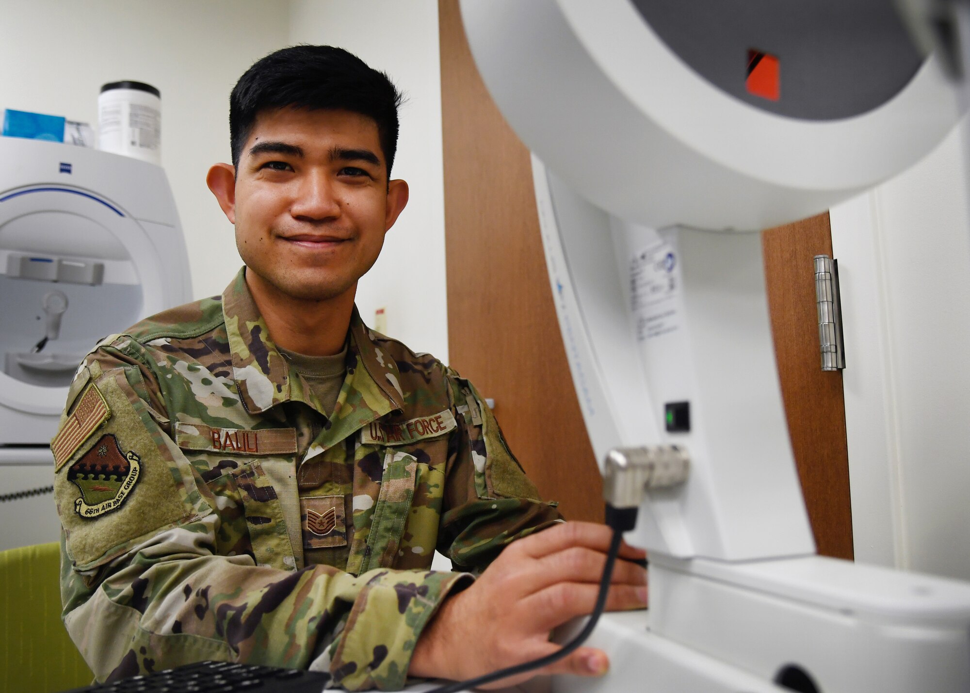 Tech. Sgt. Lloydon Balili, 66th Medical Squadron noncommissioned officer in charge of Optometry, poses for a photo in the optometry clinic at Hanscom Air Force Base, Mass., Nov. 23. Balili was named the 2020 Air Force Materiel Command Ophthalmic NCO of the Year for his support to the total force during COVID-19. (U.S. Air Force photo by Linda LaBonte Britt)