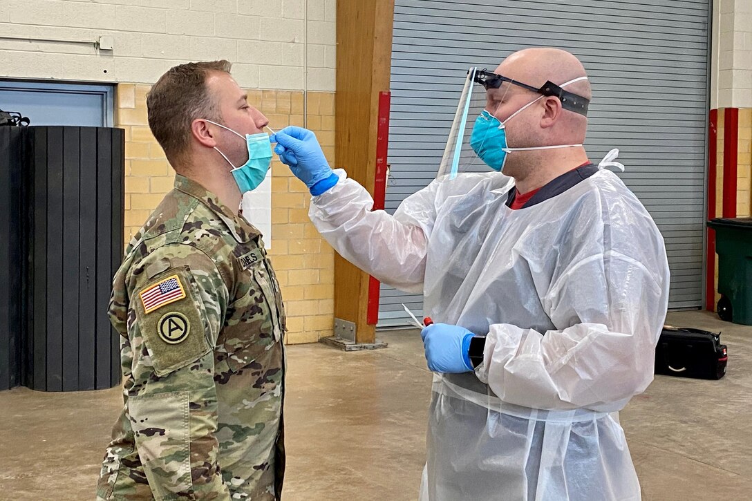 A service member gets a nasal swab test.