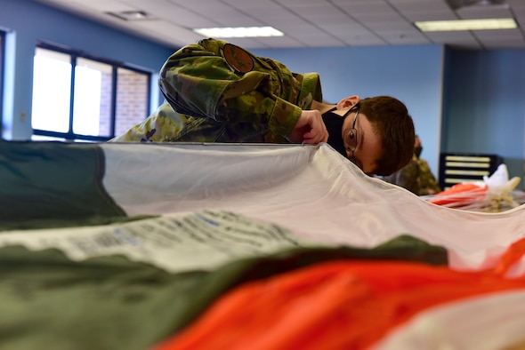 a woman looking inside an open parachute