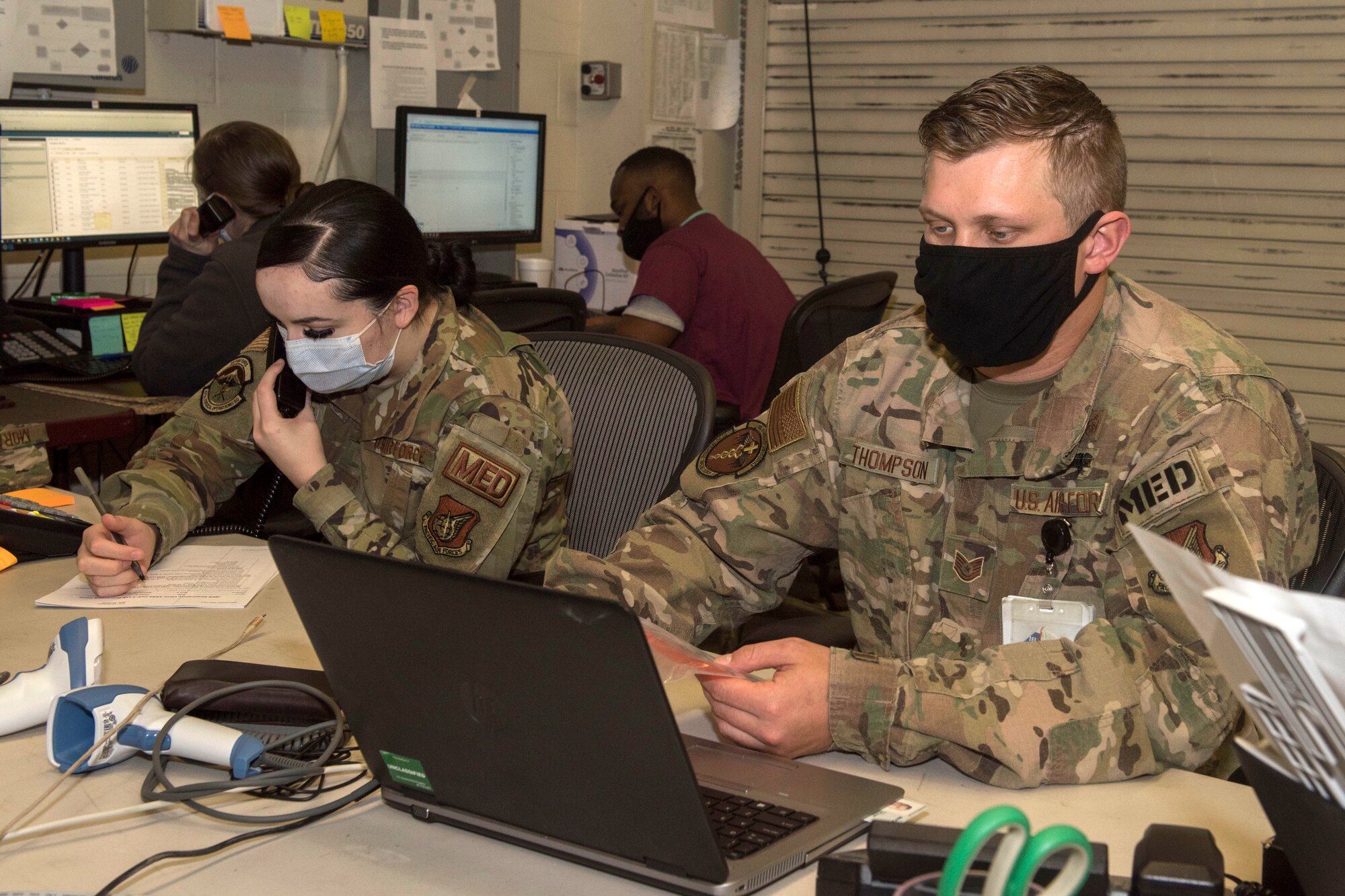 U.S. Airmen assigned to the 673d Medical Group’s respiratory clinic contact patients prior to testing at Joint Base Elmendorf-Richardson, Alaska, Nov. 20, 2020. The 673d MDG stood-up a drive-thru testing clinic to offer a fast, safe way to provide testing to base personnel and their dependents.