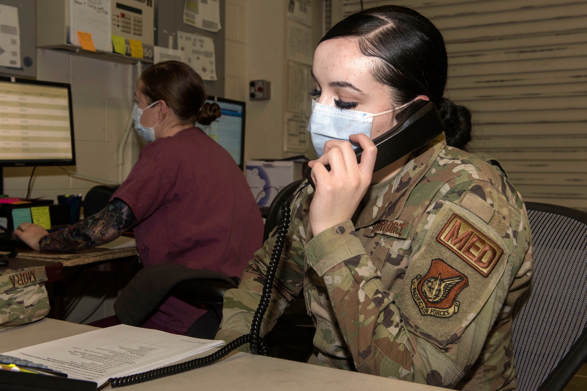 U.S. Air Force Airman 1st Class Tatiana Mora, a medical technician assigned to the 673d Medical Operations Squadron, calls a patient prior to testing at Joint Base Elmendorf-Richardson, Alaska, Nov. 20, 2020. The 673d MDG stood-up a drive-thru testing clinic to offer a fast, safe way to provide testing to base personnel and their dependents.