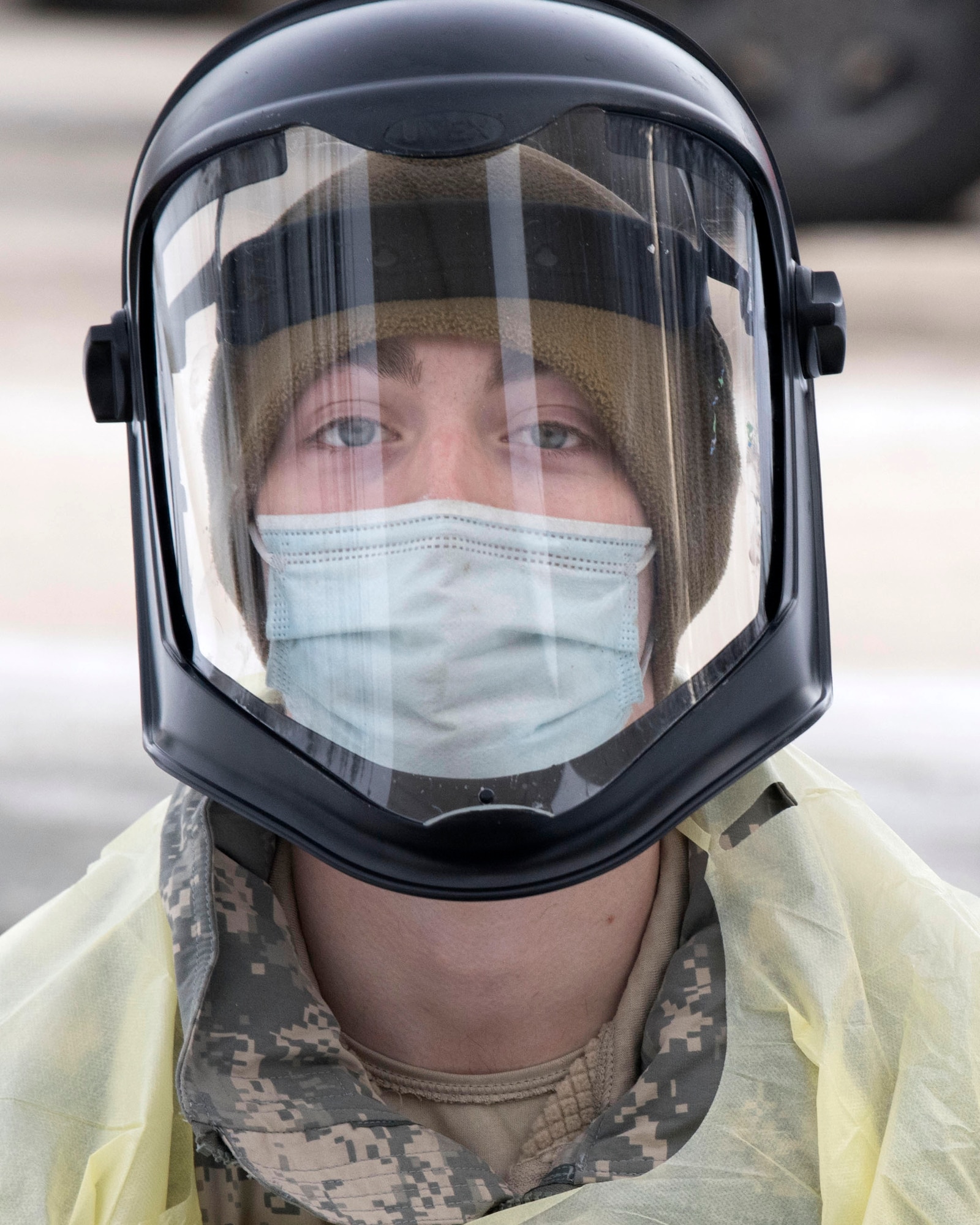 U.S. Army Pvt. Daniel Murtagh, a combat medic specialist assigned to the 1st Squadron, 40th Cavalry Regiment (Airborne), 4th Infantry Brigade Combat Team (Airborne), 25th Infantry Division, U.S. Army Alaska, pauses for a photograph between testing patients for COVID-19 at Joint Base Elmendorf-Richardson, Alaska, Nov. 20, 2020. The 673d MDG stood-up a drive-thru testing clinic to offer a fast, safe way to provide testing to base personnel and their dependents.