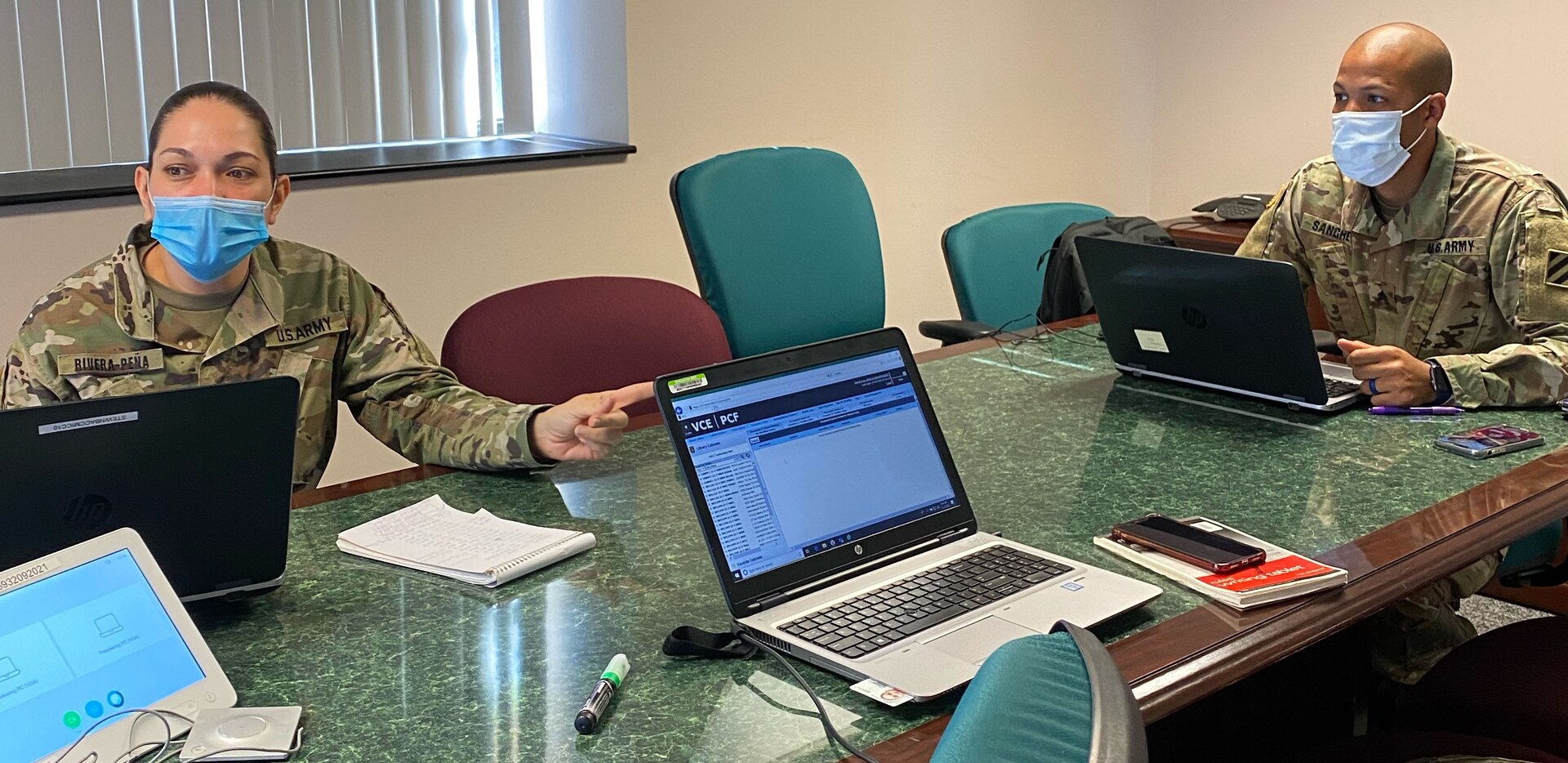 (From left) Sgt. 1st Class Mayda Rivera-Pena conducts training on the Virtual Contracting Enterprise-Paperless Contract Files acquisition system with Sgt. Tito Sanchez in preparation for a rotation in developmental assignments Nov. 9 at Fort Stewart, Georgia.