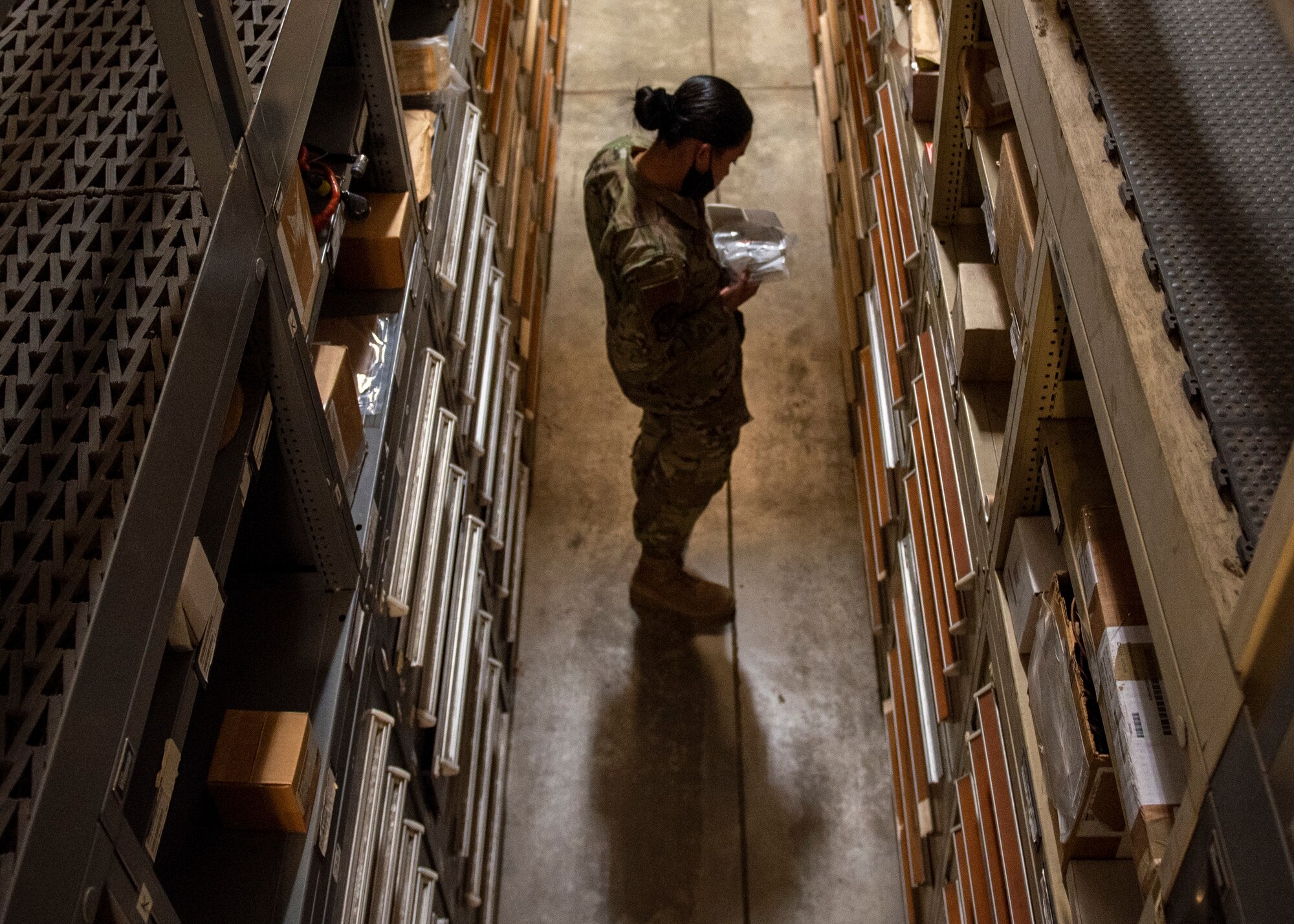 Airman 1st Class Roan Chong, 4th Logistics Readiness Squadron warehouse maintainer, grabs a part for an F-15E Strike Eagle engine at the aircraft parts store on Seymour Johnson Air Force Base, North Carolina, Nov. 6, 2020