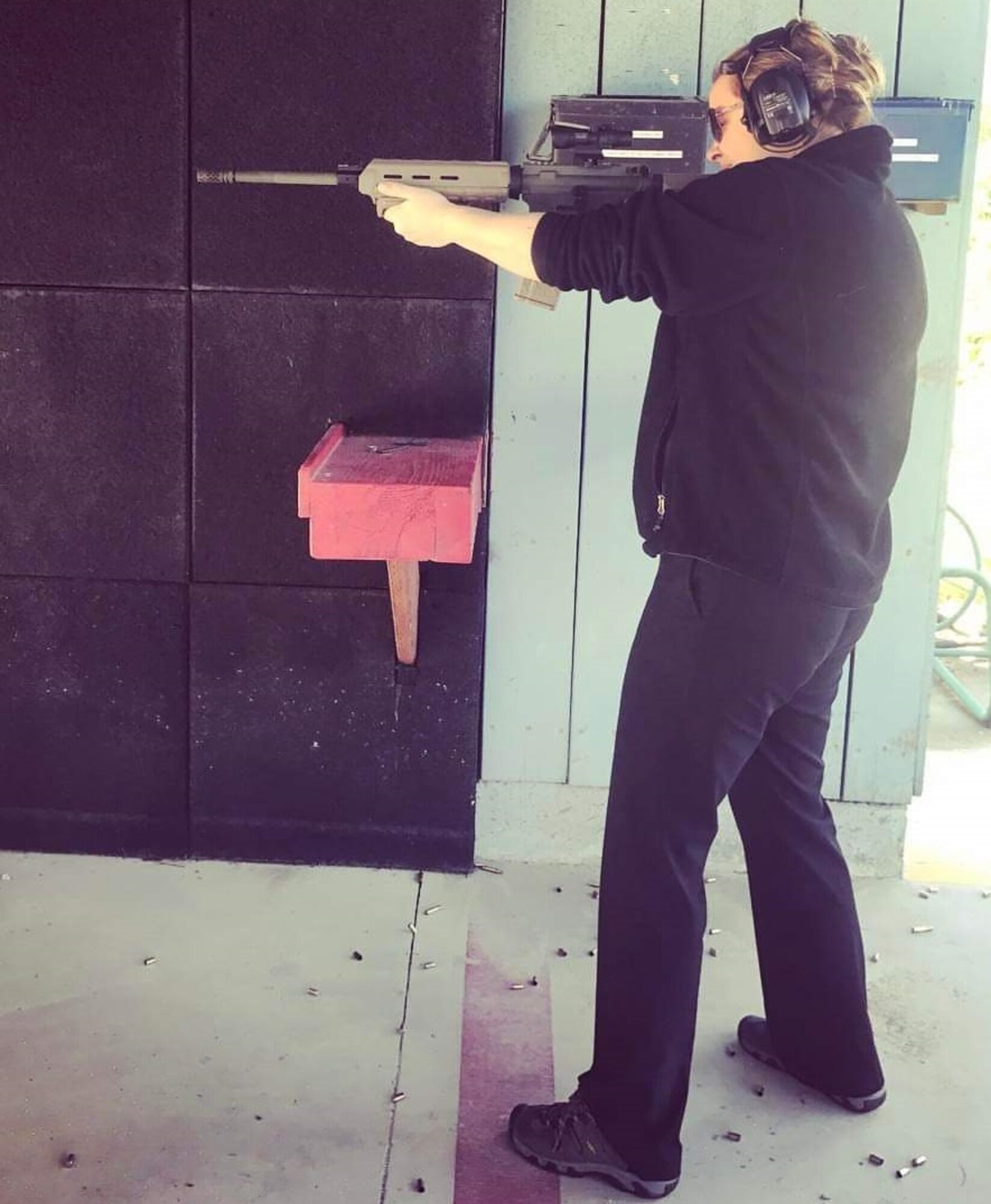 On Feb. 24, 2017, Special Agent Desiree Borg Burmeister's OSI Journey took her to the Department of Defense firing range at the Seal Beach Weapons Station, Calif., where she was qualifying on her M-9 duty weapon. While there, Marines brought an AR 5.56MM semi-automatic rifle which SA Burmeister (pictured) tried on for size. (Courtesy photo)