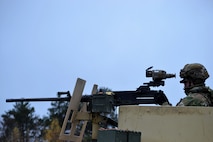 A 3-71 CAV, 10 MTN DIV Soldier takes aim with an M2 .50 caliber machine gun outfitted with the FWS-CS during testing at Fort Drum, NY