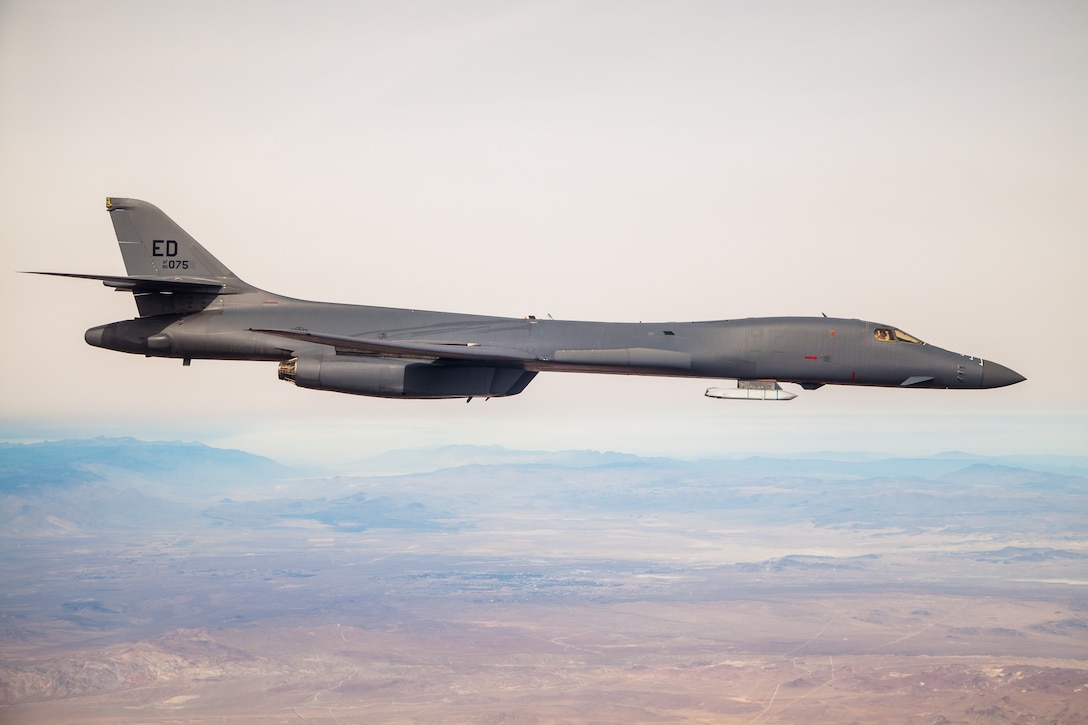 A B-1B Lancer with a Joint Air-to-Surface Standoff Missile (JASSM) flies in the skies above Edwards Air Force Base, California, Nov. 20. The flight was a demonstration of the B-1B’s external weapons carriage capabilities. (Air Force photo by Ethan Wagner)