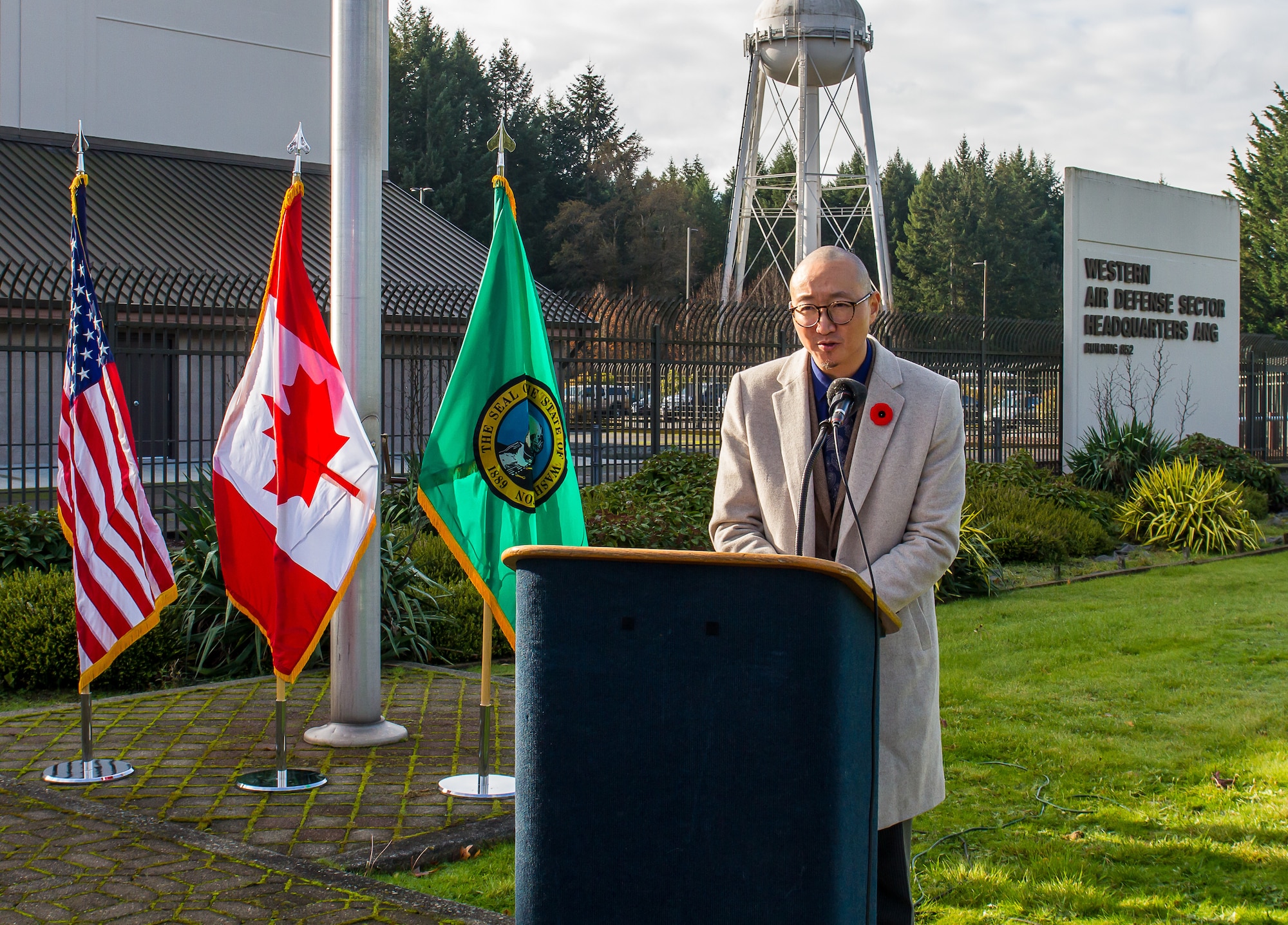 Lee gives his remarks at the podium