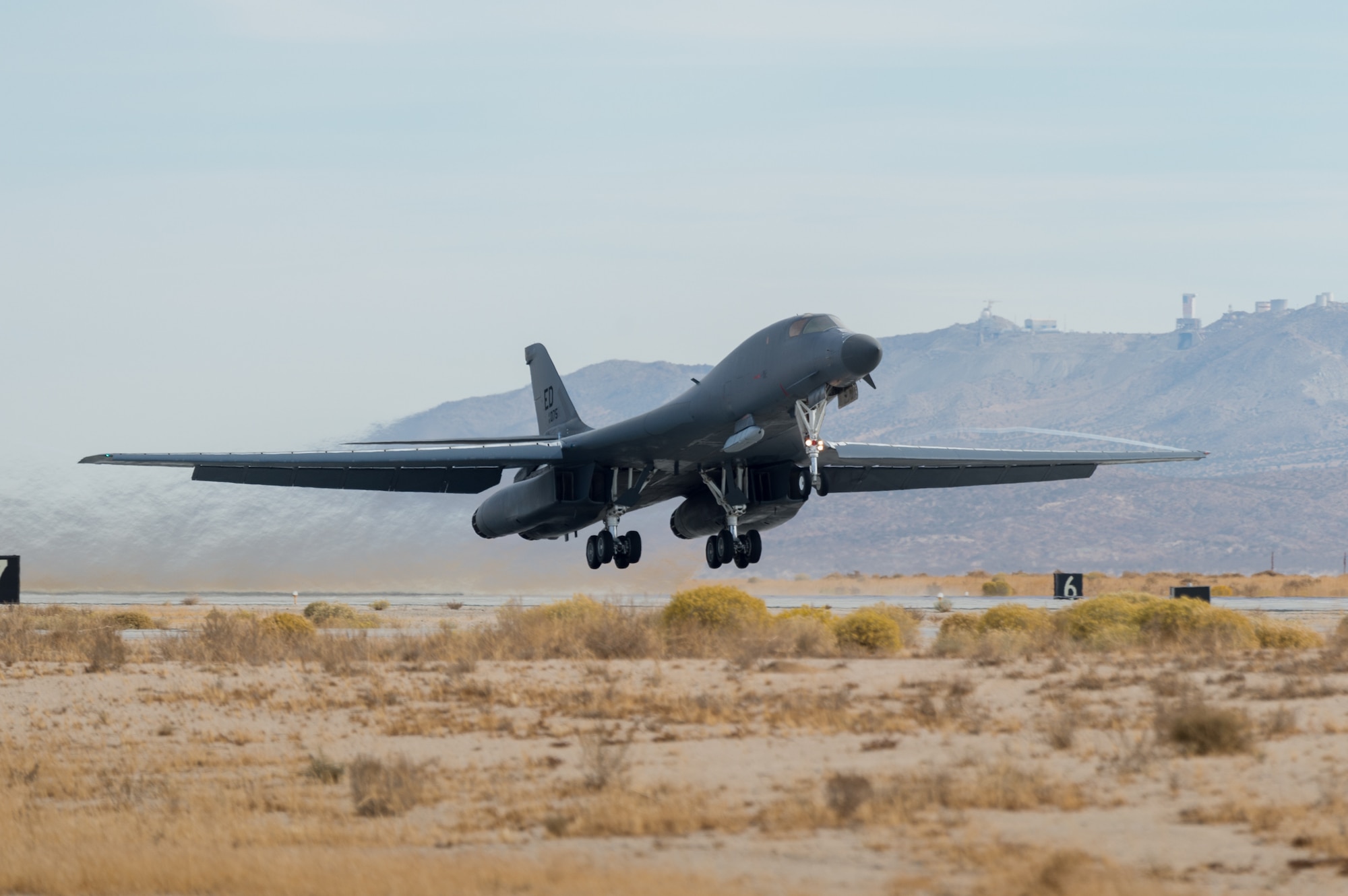 A B-1B Lancer with a Joint Air-to-Surface Standoff Missile (JASSM) takes off from Edwards Air Force Base, California, Nov. 20. The flight was a demonstration of the B-1B’s external weapons carriage capabilities. (Air Force photo by Richard Gonzales)
