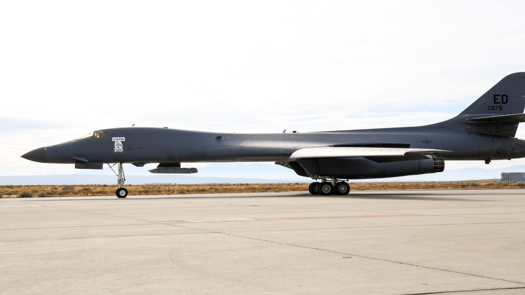 A B-1B Lancer taxis at Edwards Air Force Base, California, Nov. 20. The aircraft conducted a captive carry flight to demonstrate its external weapons capabilities with a Joint Air-to-Surface Standoff Missile (JASSM) in the skies over Edwards. (Air Force photo by 2nd Lt. Christine Saunders)