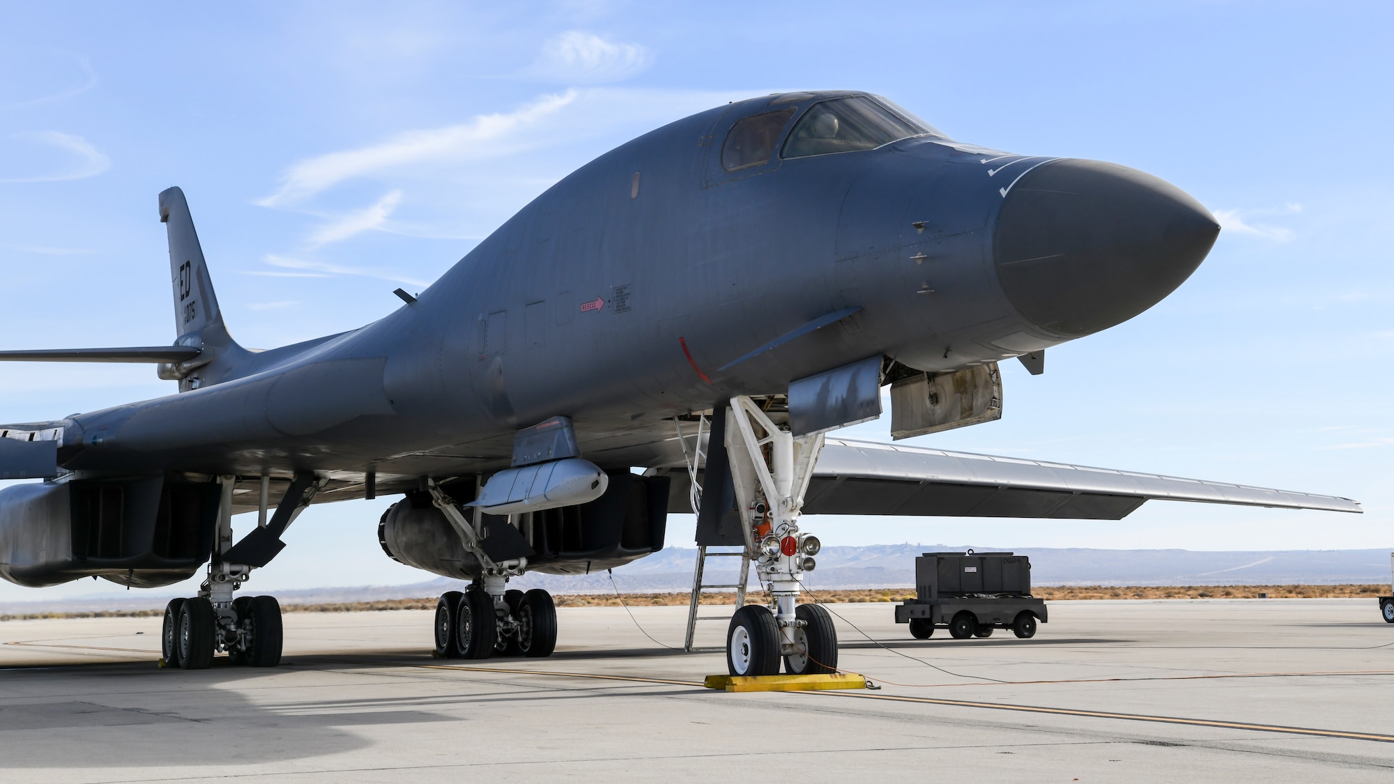 A B-1B Lancer prepares to conduct a captive carry flight to demonstrate its external weapons carriage capabilities at Edwards Air Force Base, California, Nov. 20. (Air Force photo by 2nd Lt. Christine Saunders)