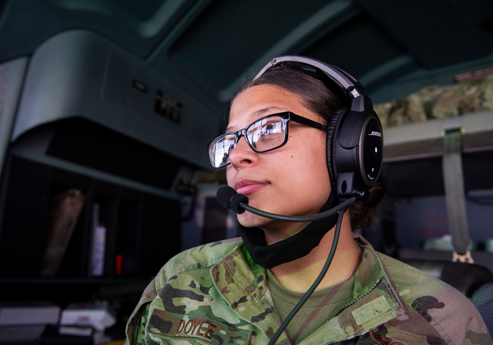 U.S. Air Force Airman 1st Class Kim Doyle, a loadmaster assigned to the 36th Airlift Squadron, Yokota Air Base, Japan, observes  the island of Palau before arrival over the Indo-Pacific during a Dynamic Force Employment, Nov. 23, 2020. DFE is an operational platform that allows our forces to be strategically predictable and operationally unpredictable. The U.S. Air Force is postured and ready to respond to crises and contingencies throughout the U.S. Indo-Pacific Command, contributing to regional stability and a free and open Indo-Pacific. (U.S. Air Force photo by Senior Airman Michael S. Murphy)