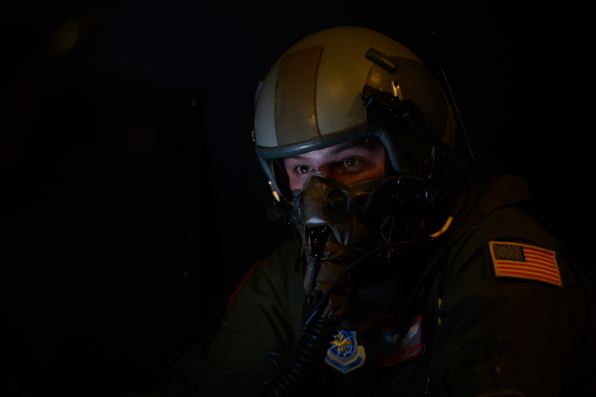 U.S. Air Force Staff Sgt. Cameron DiMatteo, 22nd Airlift Squadron loadmaster, waits for the C-5M Super Galaxy to take off during a base exercise Nov. 18, 2020, at Travis Air Force Base, California. Airmen at Travis AFB participate in readiness exercises to ensure they can operate in contested environments. (U.S. Air Force photo by Chustine Minoda)