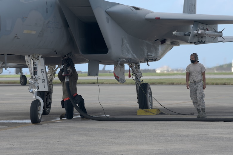 Airmen from the 18th Logistics Readiness Squadron showcase a new hot pit refueling flow during a “Super Surge,” Nov. 18, 2020, at Kadena Air Base, Japan. The LRS team pumped 1,389,391 gallons of fuel; 650,417 gallons were for the F-15C Eagles alone. (U.S. Air Force photo by Airman 1st Class Rebeckah Medeiros)