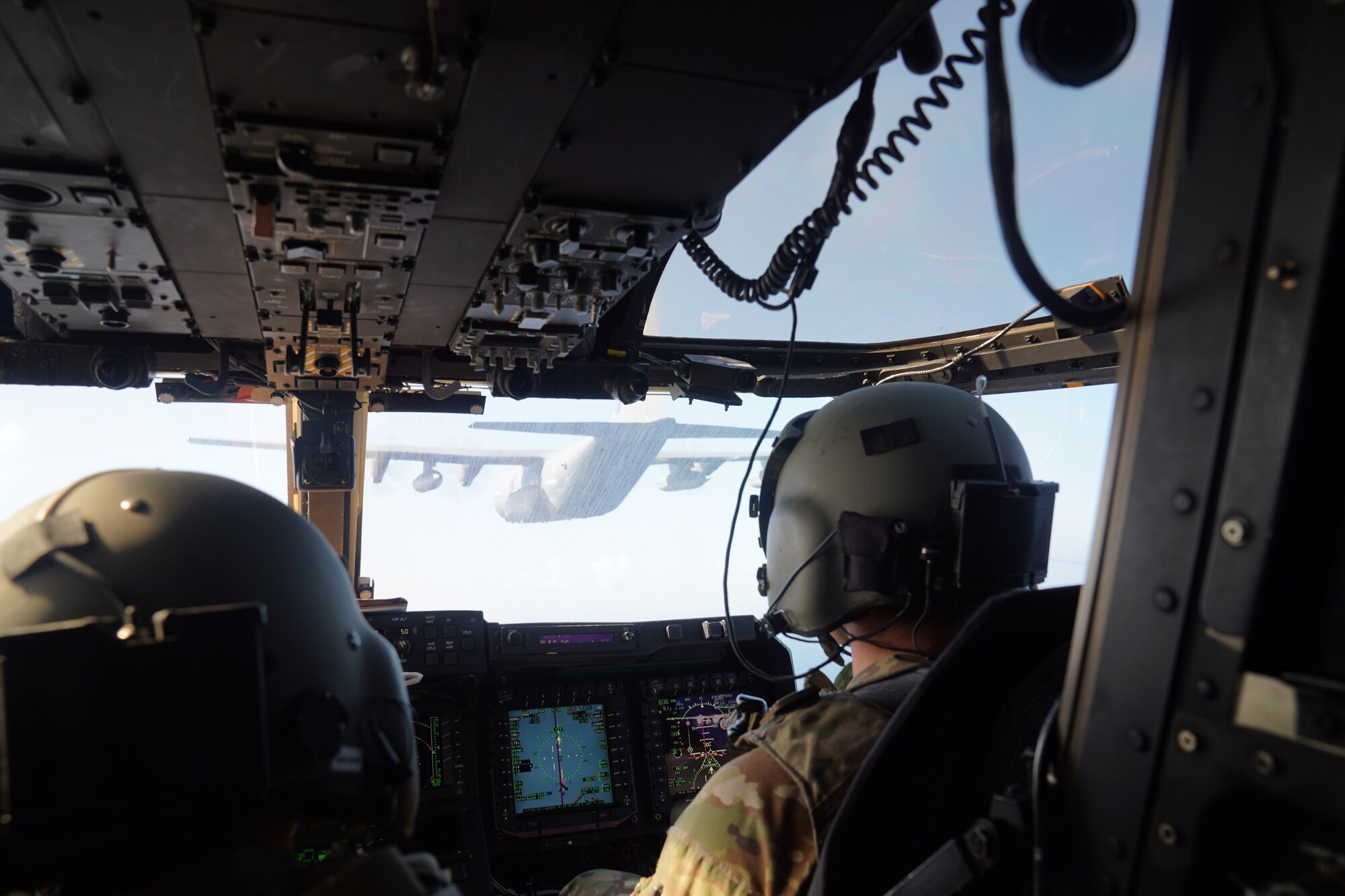 Airmen with the 21st Special Operations Squadron prepare to conduct tactical air-to-air refueling during search and rescue training off the coast of Okinawa, Japan, Nov. 19, 2020.