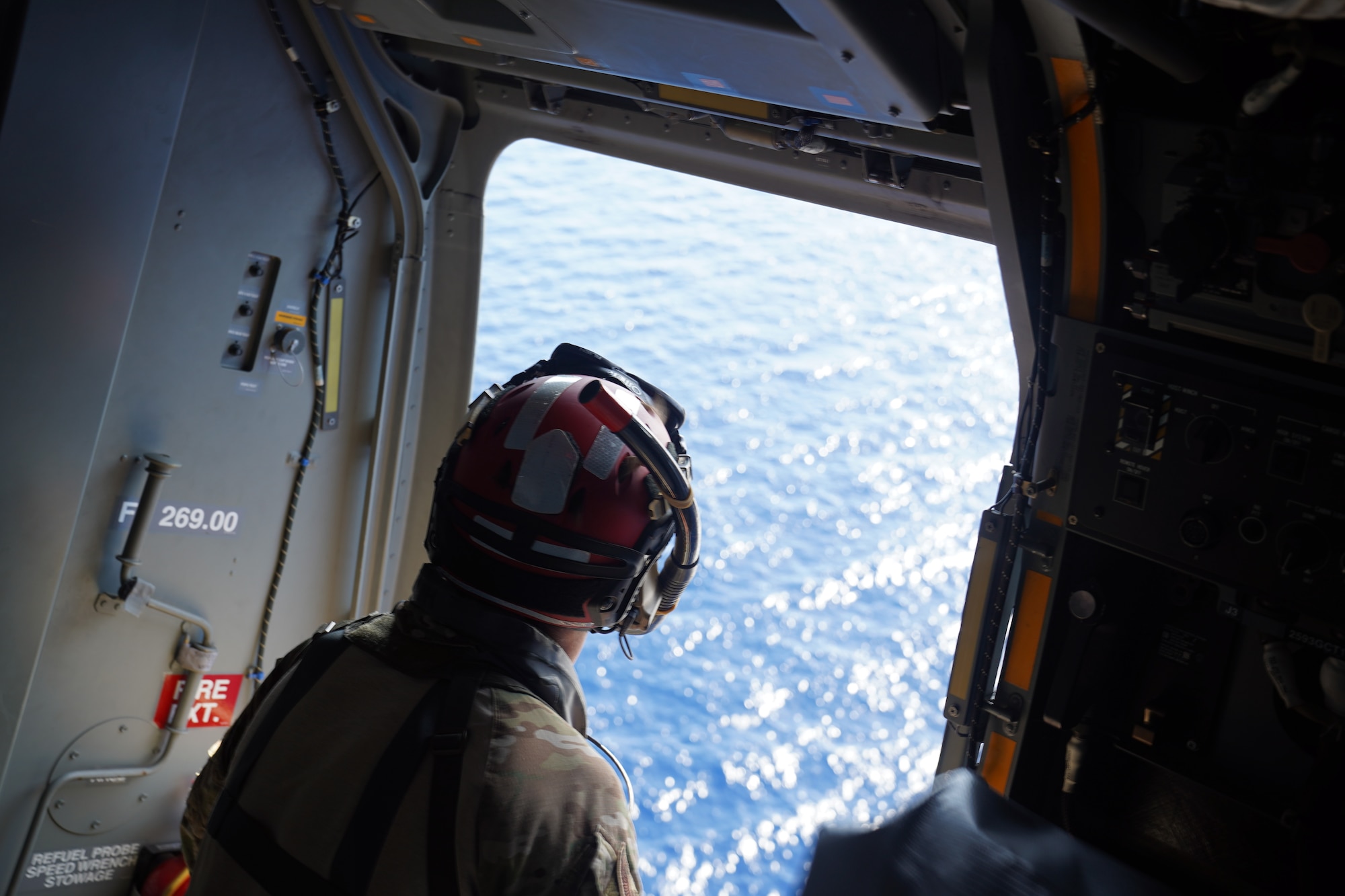 A search, evasion, resistance and escape specialist with the 320th Special Tactics Squadron searches for signs of a simulated isolated person during an open water search and rescue training off the coast of Okinawa, Japan, Nov. 19, 2020.