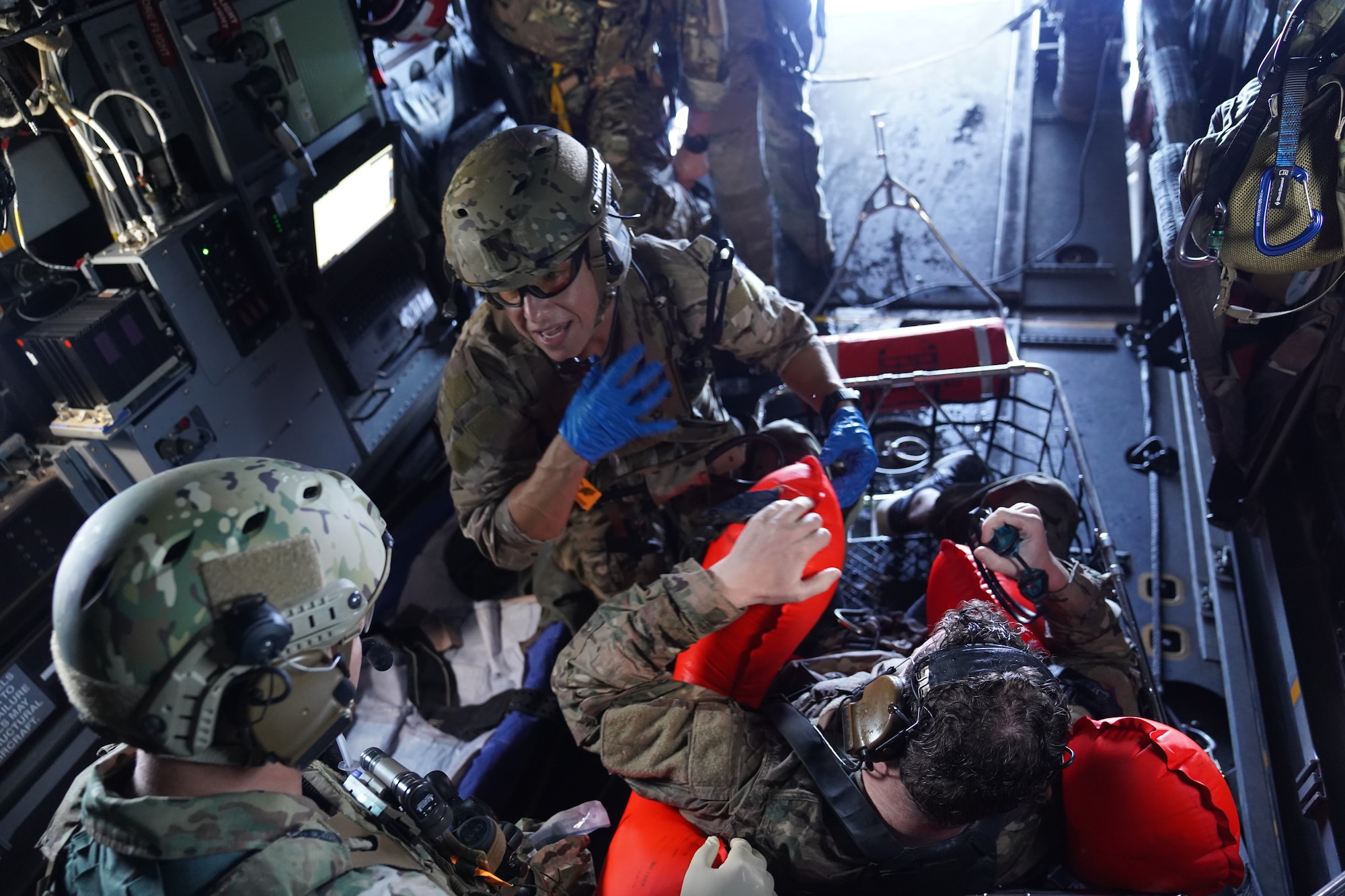 Major Shana Hirchert, 353rd Special Operations Support Squadron flight surgeon, directs initial medical triage and care of a recovered casualty role-player during an open water search and rescue training off the coast of Okinawa, Japan, Nov. 19, 2020.