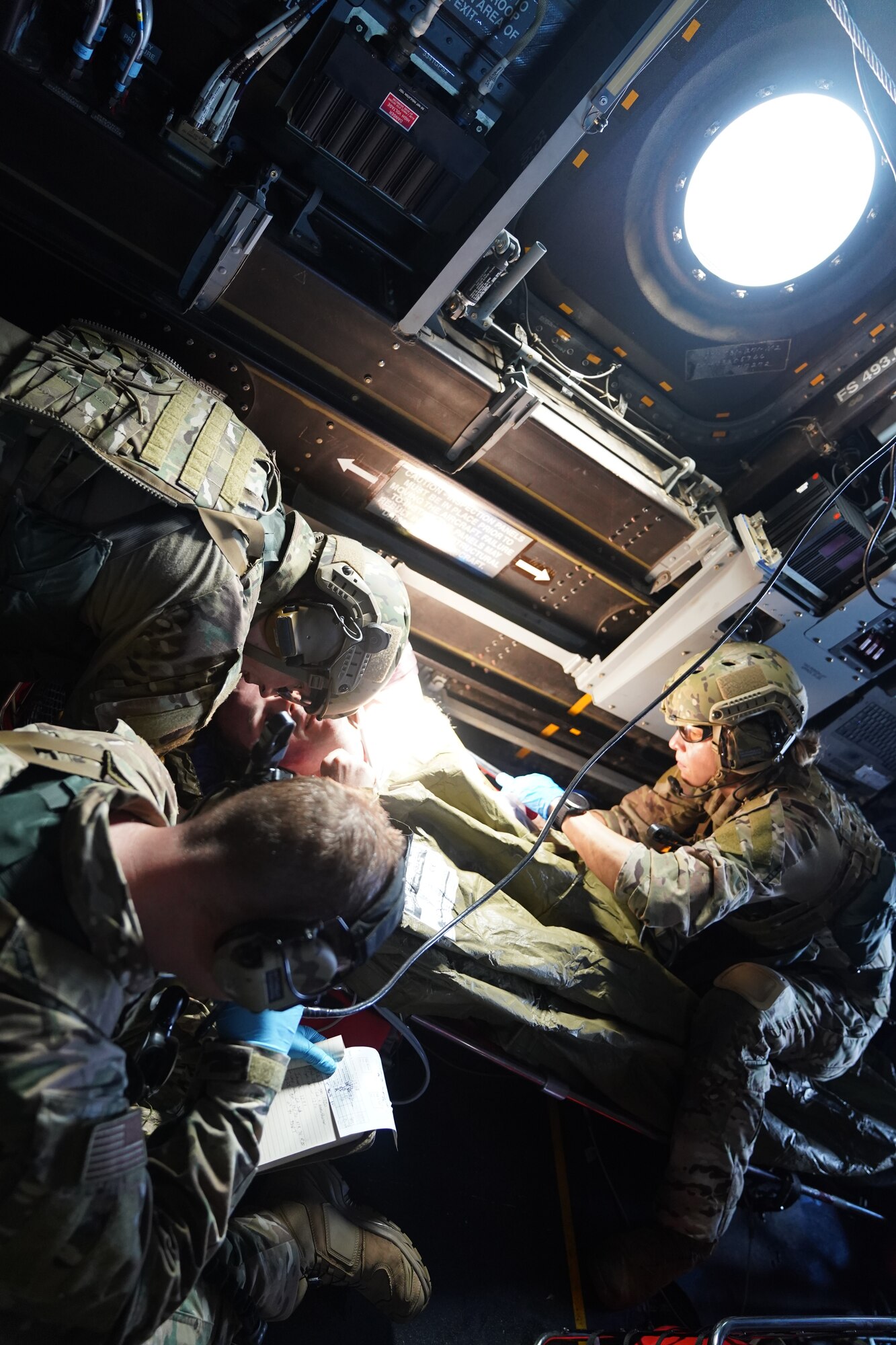 Special Operations Forces Medical Element members with the 353rd Special Operations Support Squadron conduct triage and emergency care of a recovered casualty role-player during an open water search and rescue training off the coast of Okinawa, Japan, Nov. 19, 2020.