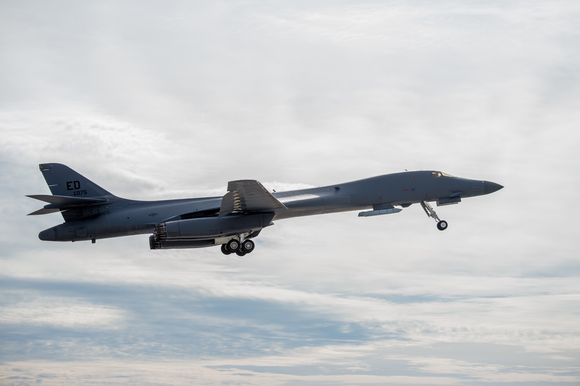 A B-1B Lancer with a Joint Air-to-Surface Standoff Missile (JASSM) takes off from Edwards Air Force Base, California, Nov. 20. The flight was a demonstration of the B-1B’s external weapons carriage capabilities. (Air Force photo by Richard Gonzales)