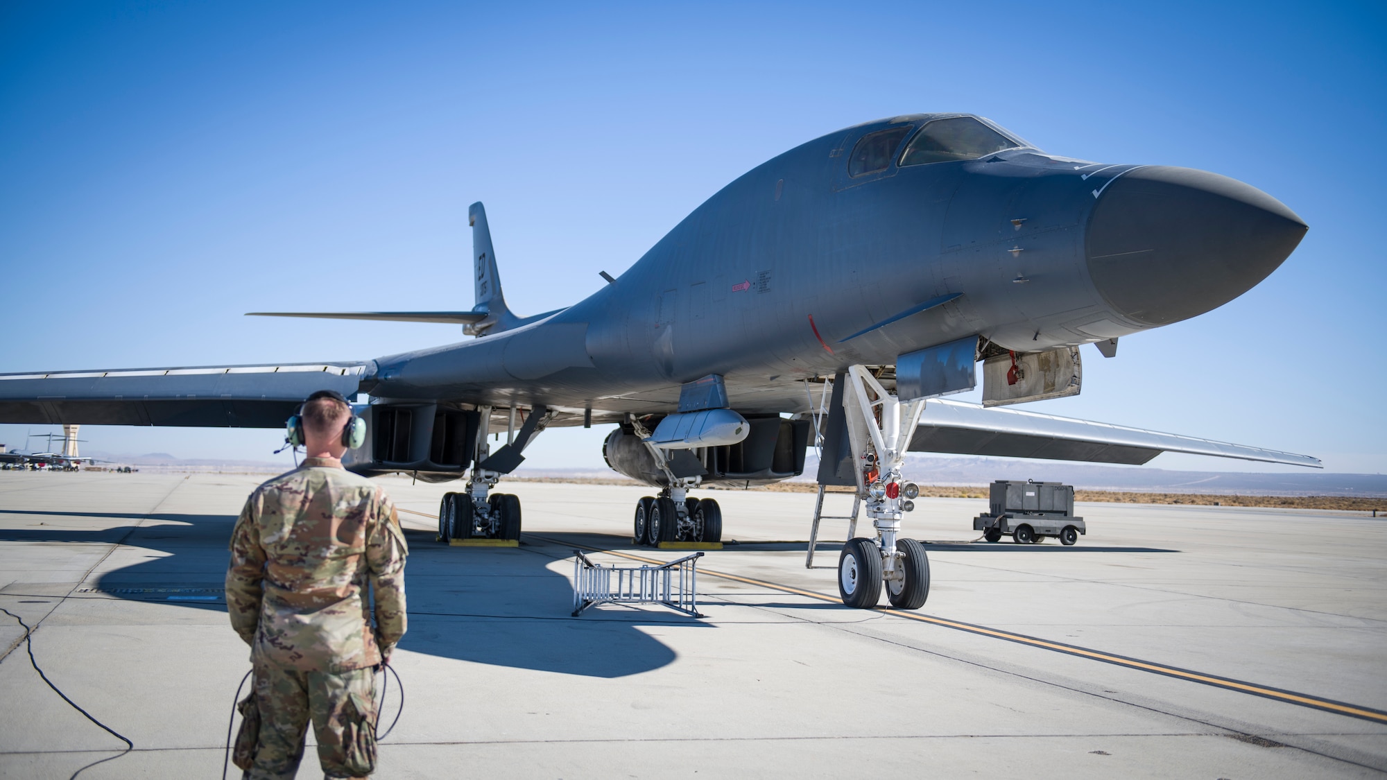 A B-1B Lancer with a Joint Air-to-Surface Standoff Missile (JASSM) undergoes pre-flight procedures prior to a captive carry external weapons demonstration flight at Edwards Air Force Base, California, Nov. 17. (Air Force photo by Giancarlo Casem)