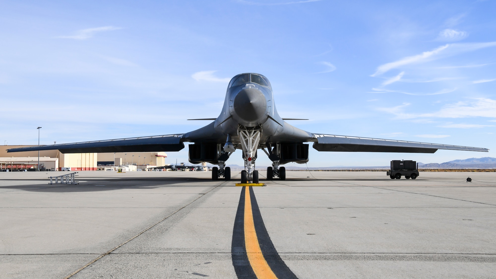 A B-1B Lancer prepares to conduct a captive carry flight to demonstrate its external weapons carriage capabilities at Edwards Air Force Base, California, Nov. 20. (Air Force photo by 2nd Lt. Christine Saunders)