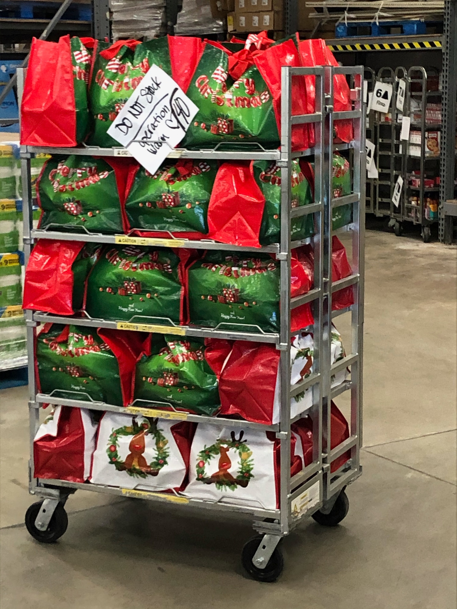 Dozens of bags filled with Thanksgiving food items are ready to be picked up by first sergeants Nov. 20, 2020, at Hill Air Force Base, Utah. Operation Warm Heart, a first sergeant’s program, teamed with the commissary to deliver bags filled with turkeys, hams and other goods to assist Airmen and their families with the upcoming holiday. (Courtesy photo)